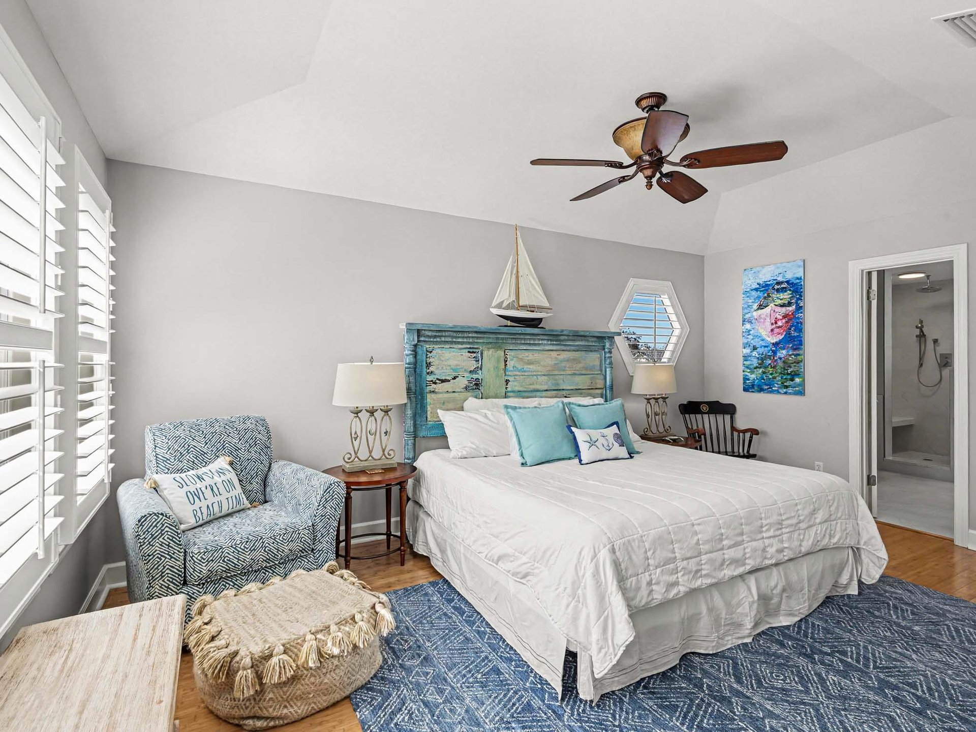 Drift off to sleep in this coastalinspired bedroom with ocean breezes from your ceiling fan and nautical touches throughout.