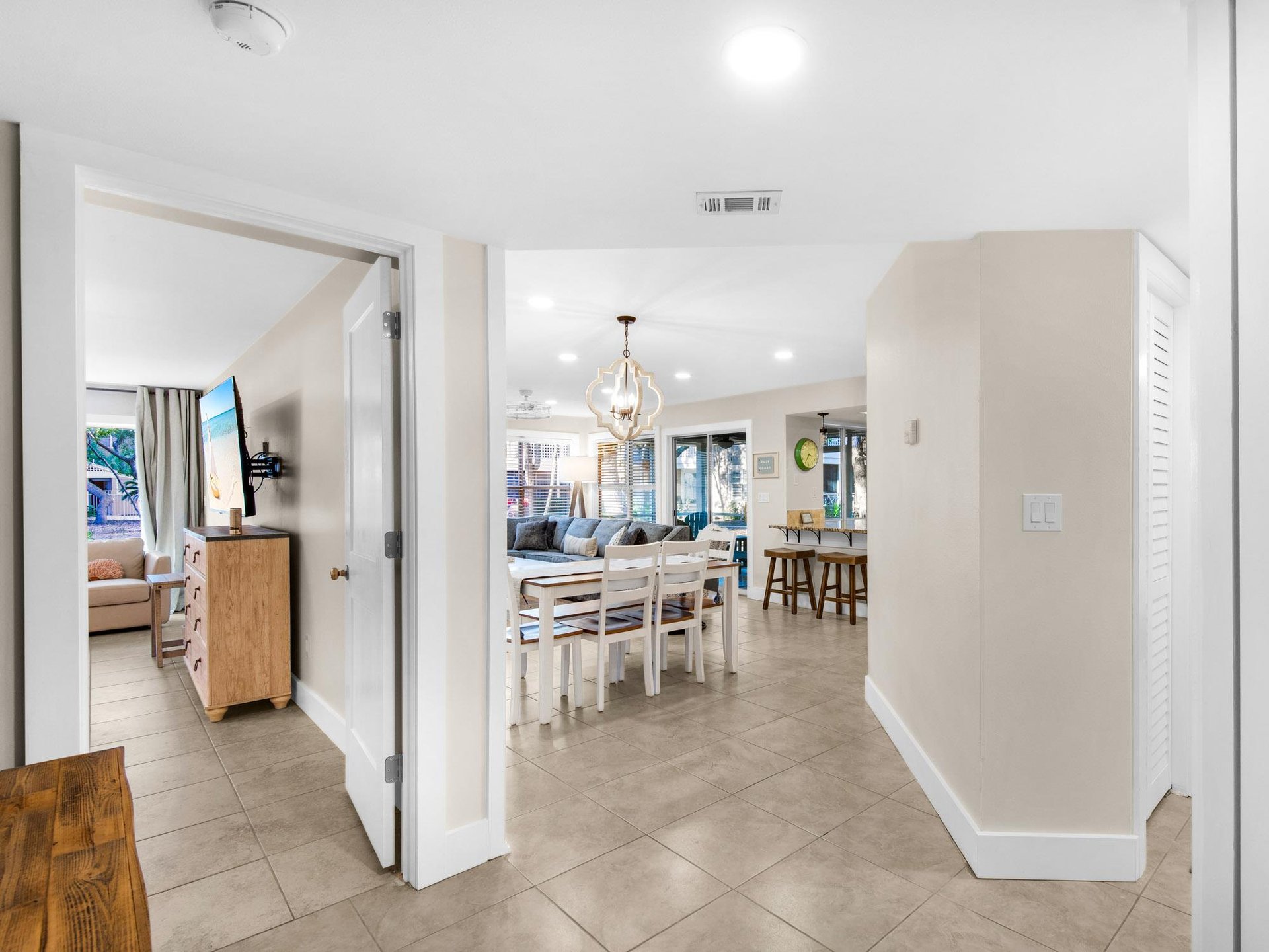 Step into your bright, openplan living space where natural light flows through every corner, connecting the dining area to your comfortable living area