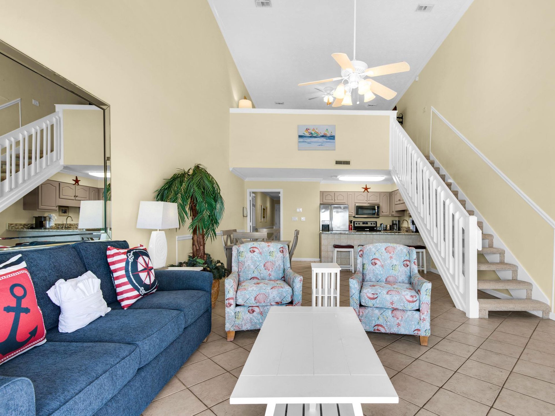 Step into your bright coastal retreat where nautical touches and vaulted ceilings create the perfect beachside atmosphere for relaxing.