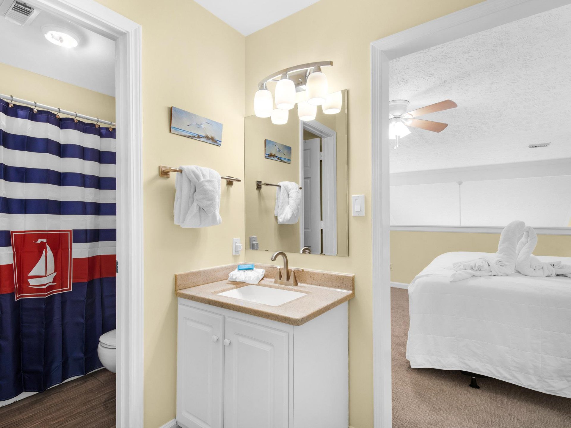 Fresh towels await in the coastalthemed guest Bathroom