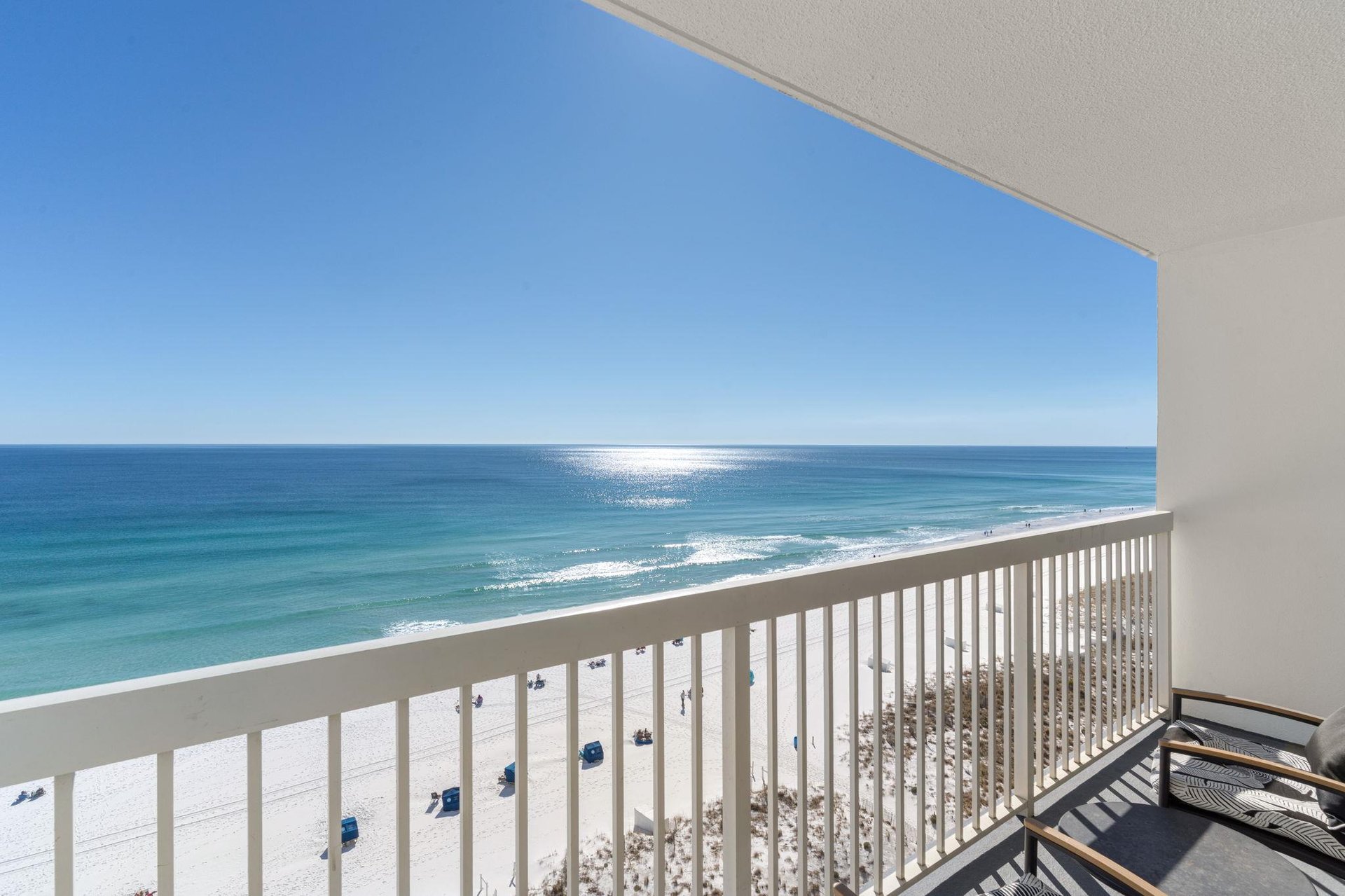 Step onto the private balcony and breathe in the salty air