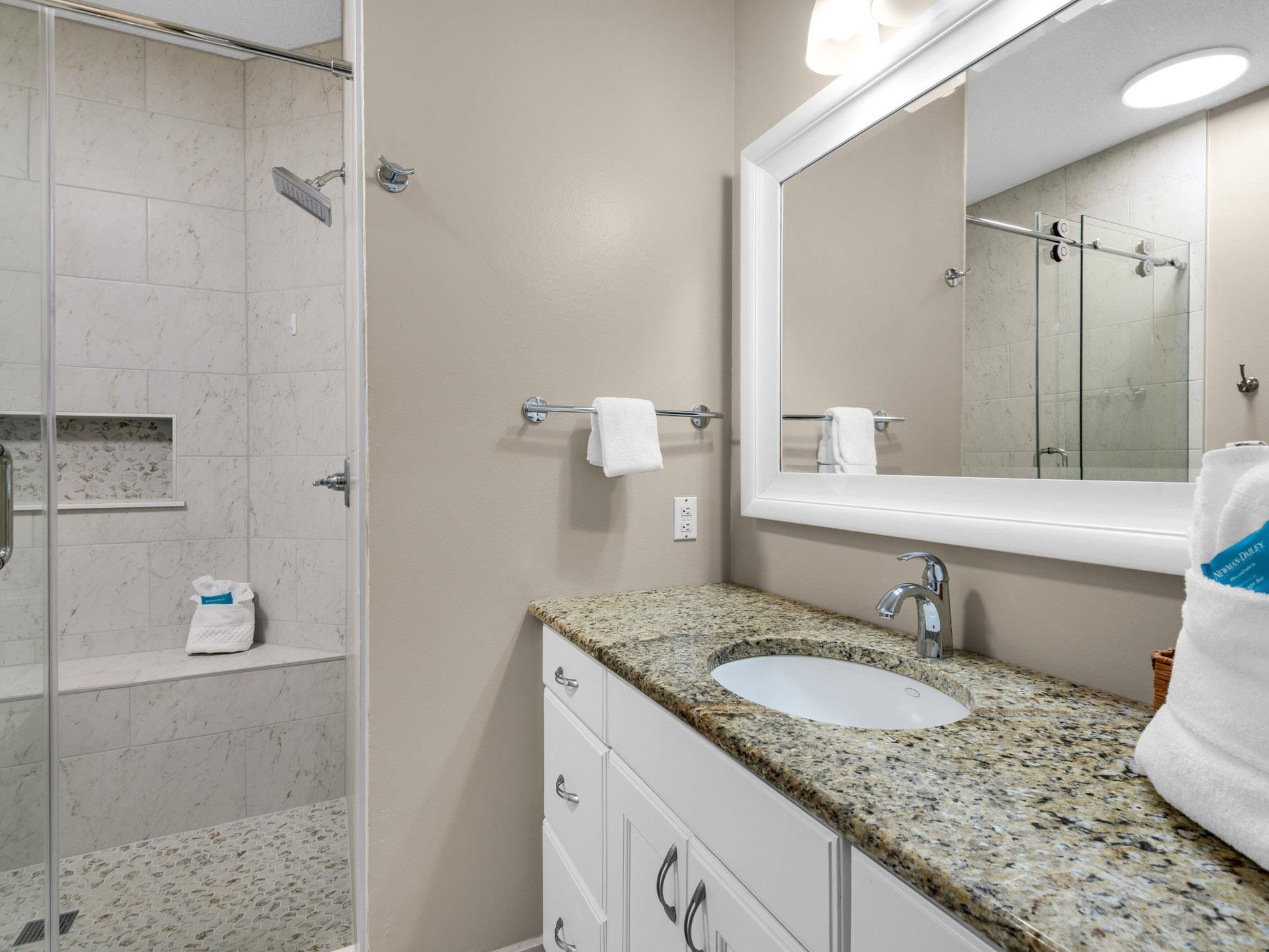 Your spalike bathroom features granite counters, rainfall shower, and fluffy towels for your comfort.