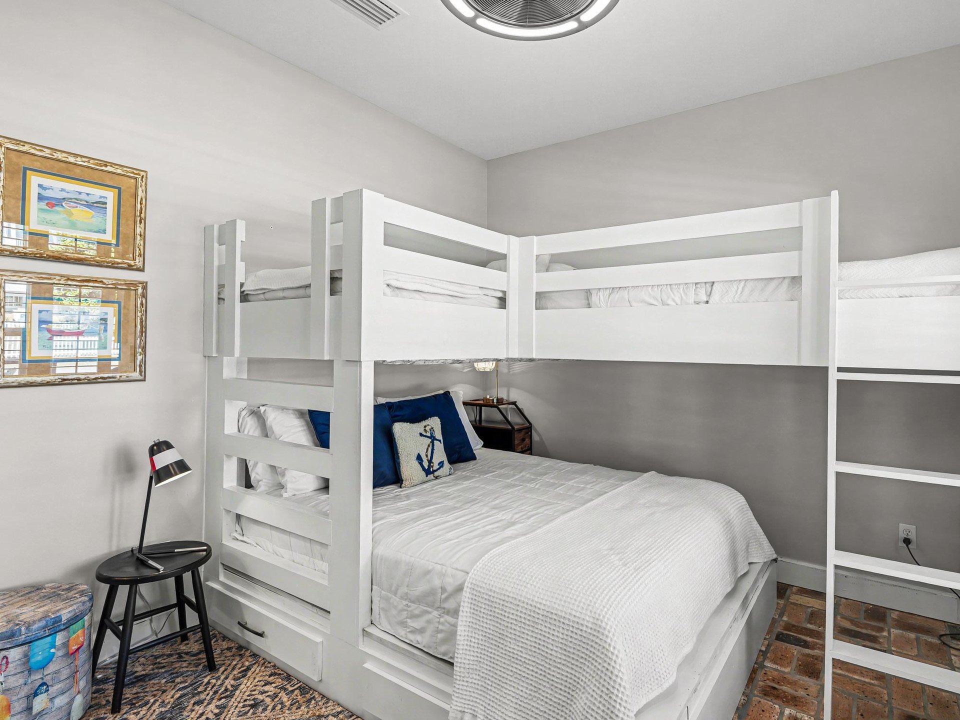 Your cozy bunk room features crisp white linens and nautical touches, perfect for family adventures.