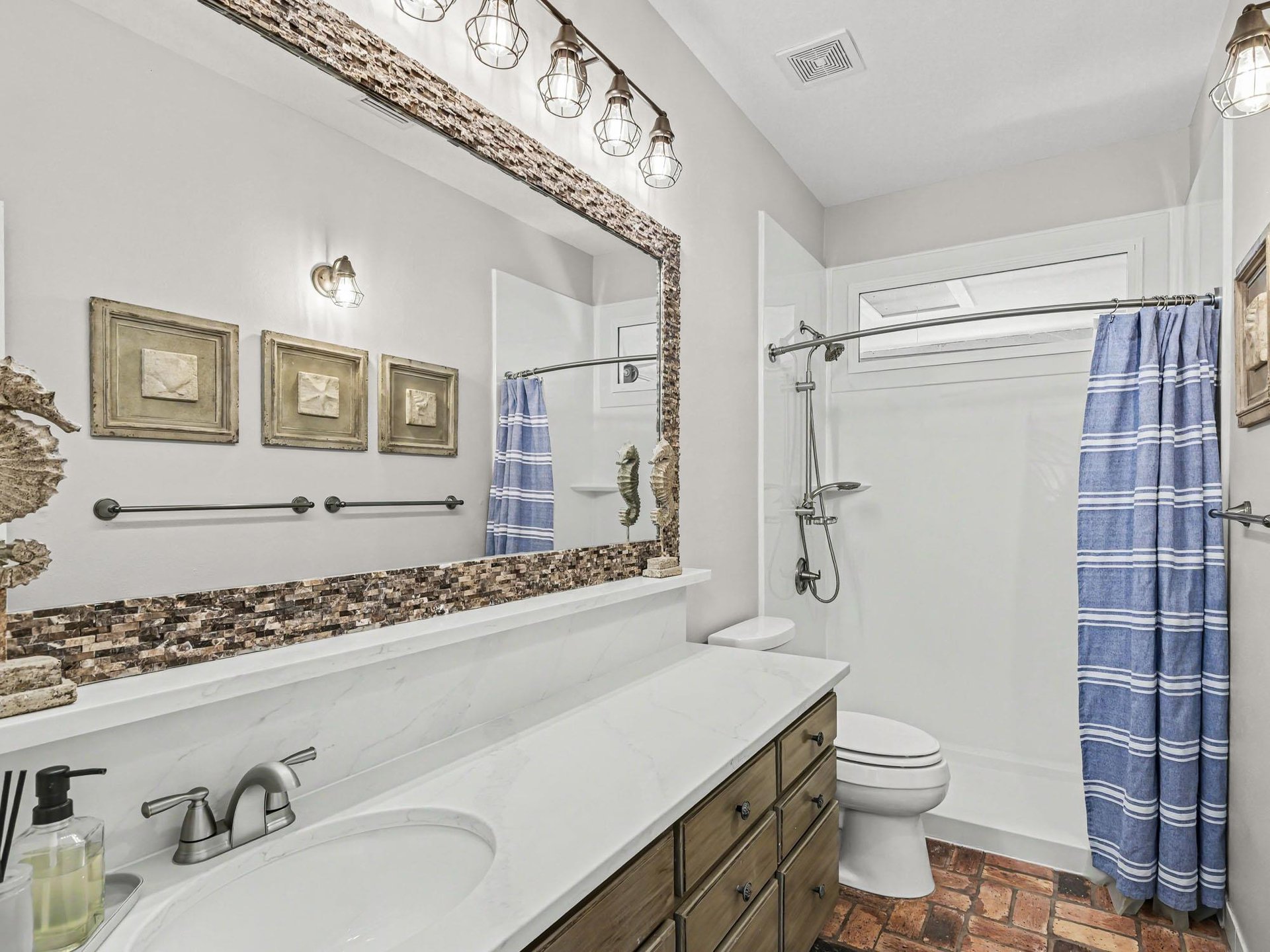 Unwind in your stylish bathroom with gorgeous mosaic accents and warm lighting creating the perfect spalike retreat.