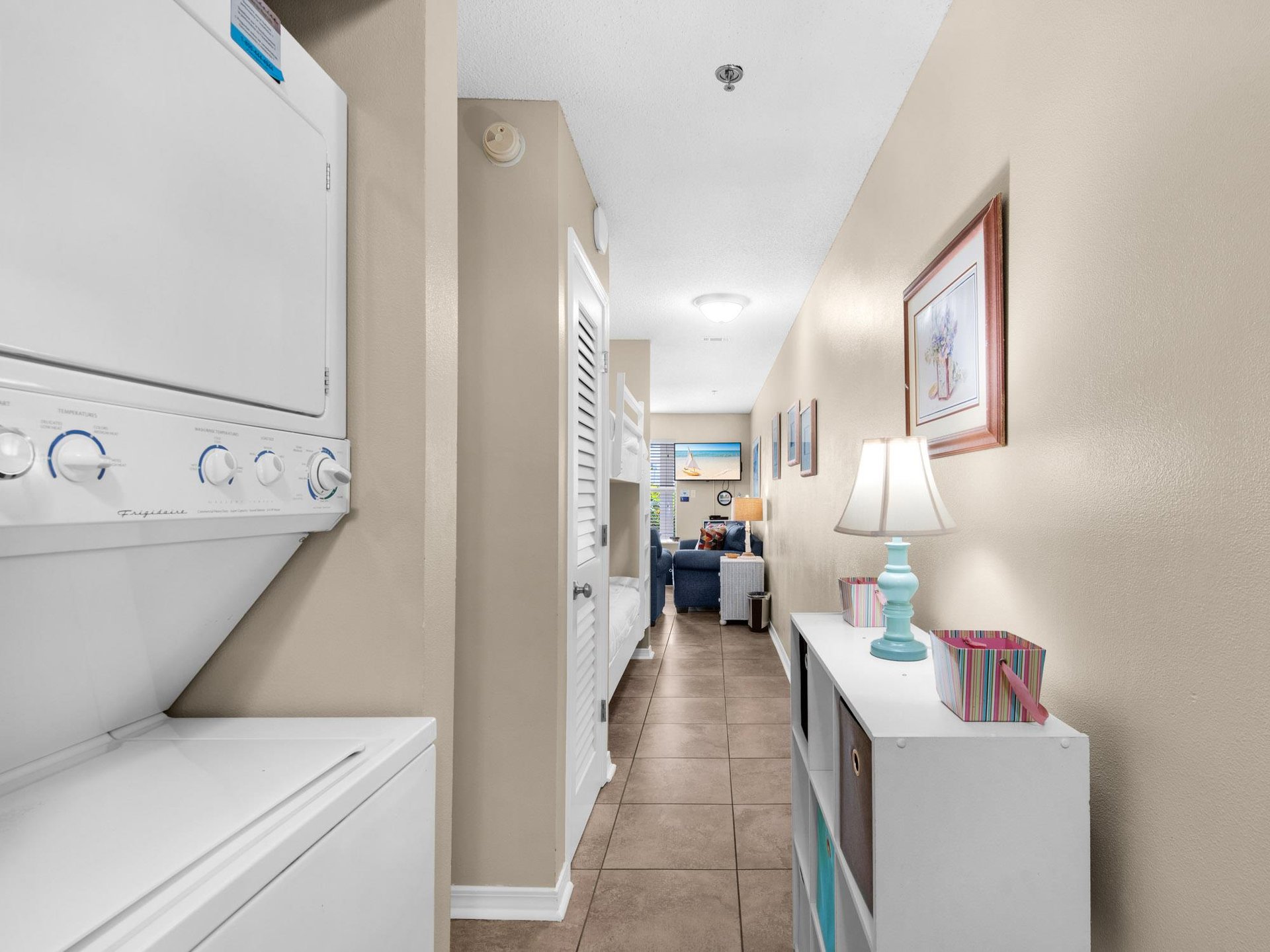 Convenient private laundry room keeps you organized with a washer and dryer