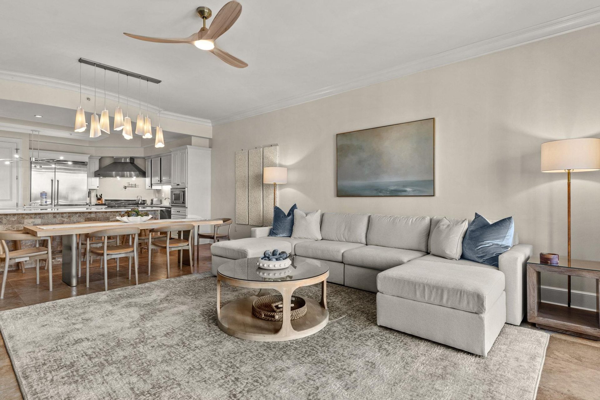 Sink into this plush sectional sofa where coastal blues meet modern comfort, perfect for movie nights in your stylish openplan retreat.