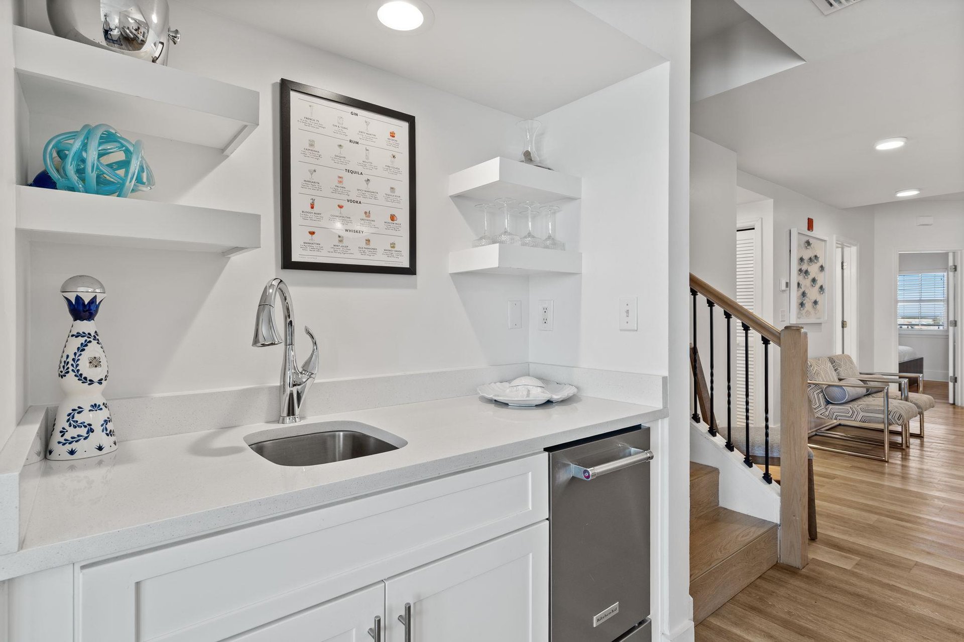 The wet bar with stainless steel ice maker and sleek sink for effortless entertaining.