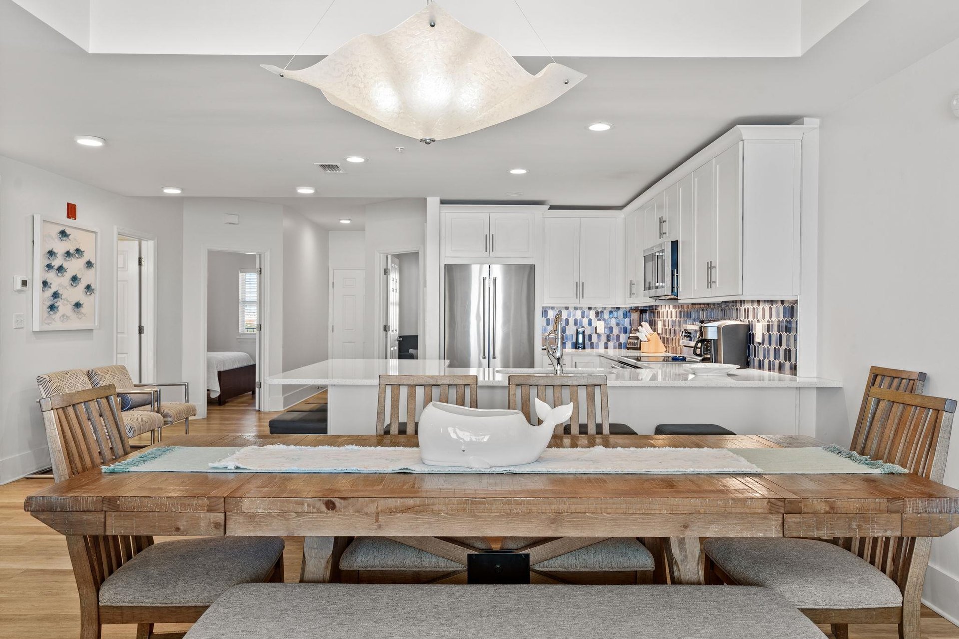 Gather around this stunning table where warm wood meets modern elegance..