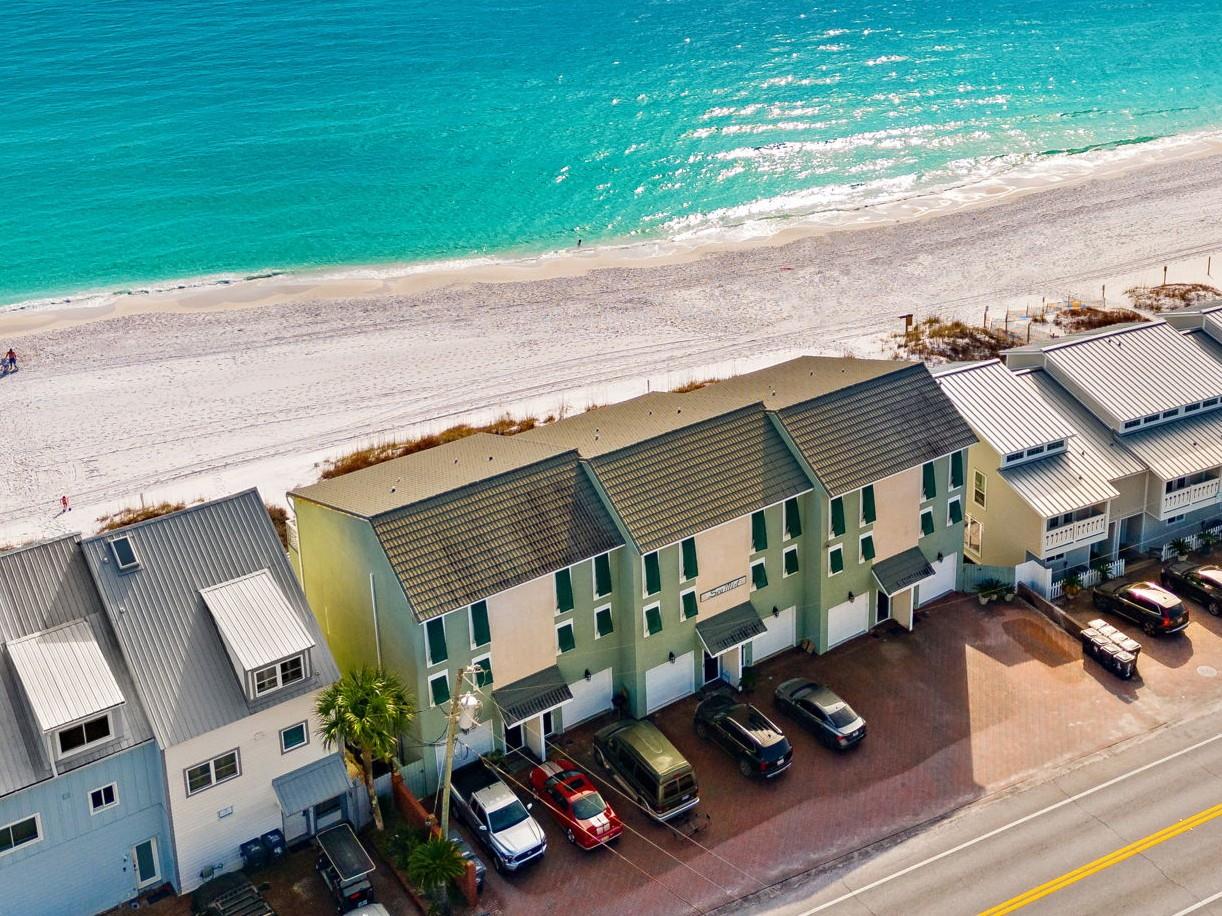 Stunning gulf front property sits steps from pristine turquoise waters and white sand beaches.