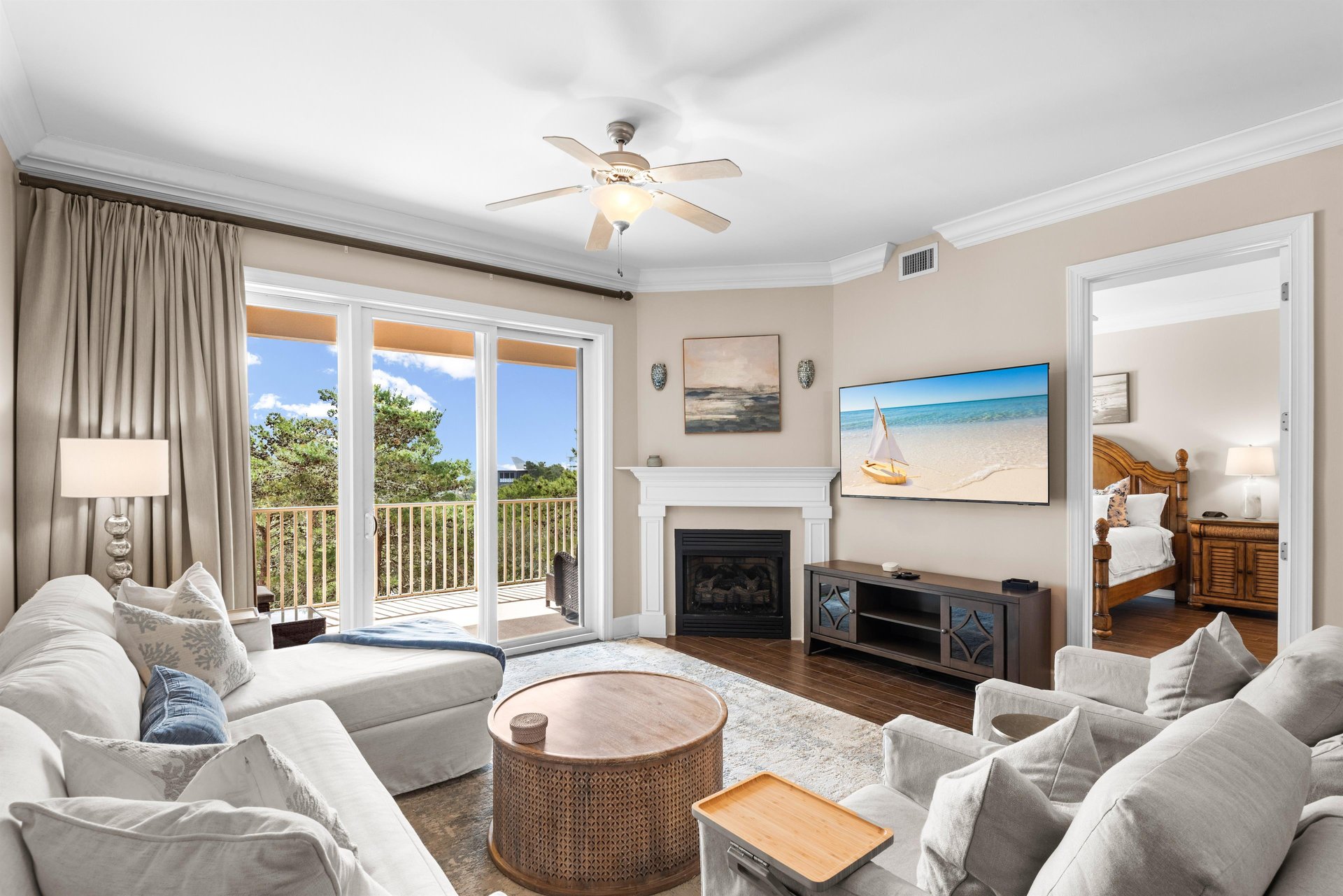 Settle into plush seating by the cozy fireplace and take in coastline views from the private balcony in this bright, airy retreat.