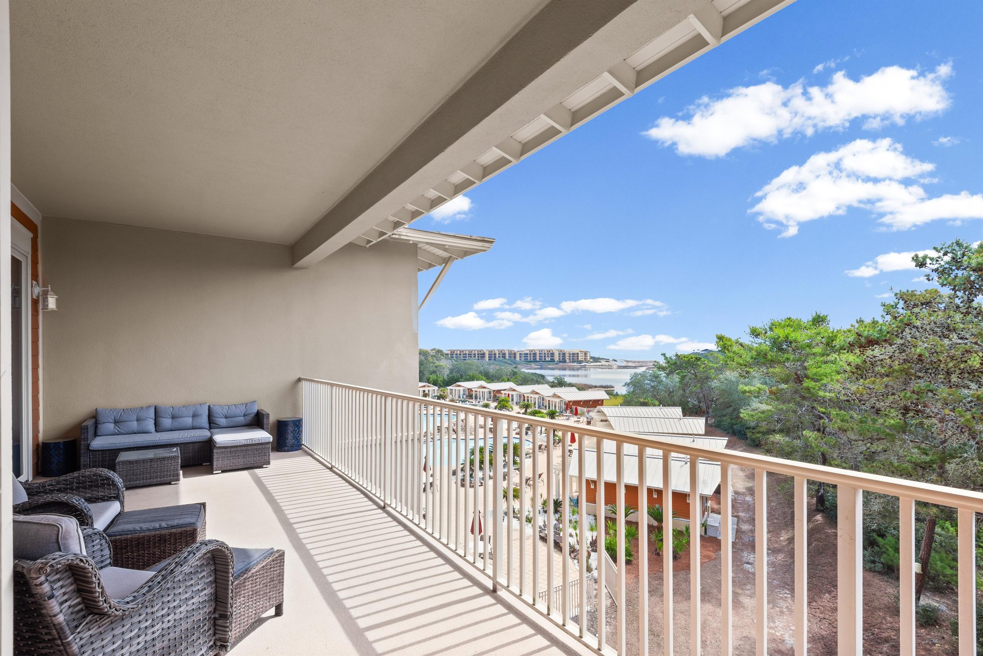 Relax on this spacious balcony with comfortable seating, where you can unwind while taking in beautiful views of the surrounding area.