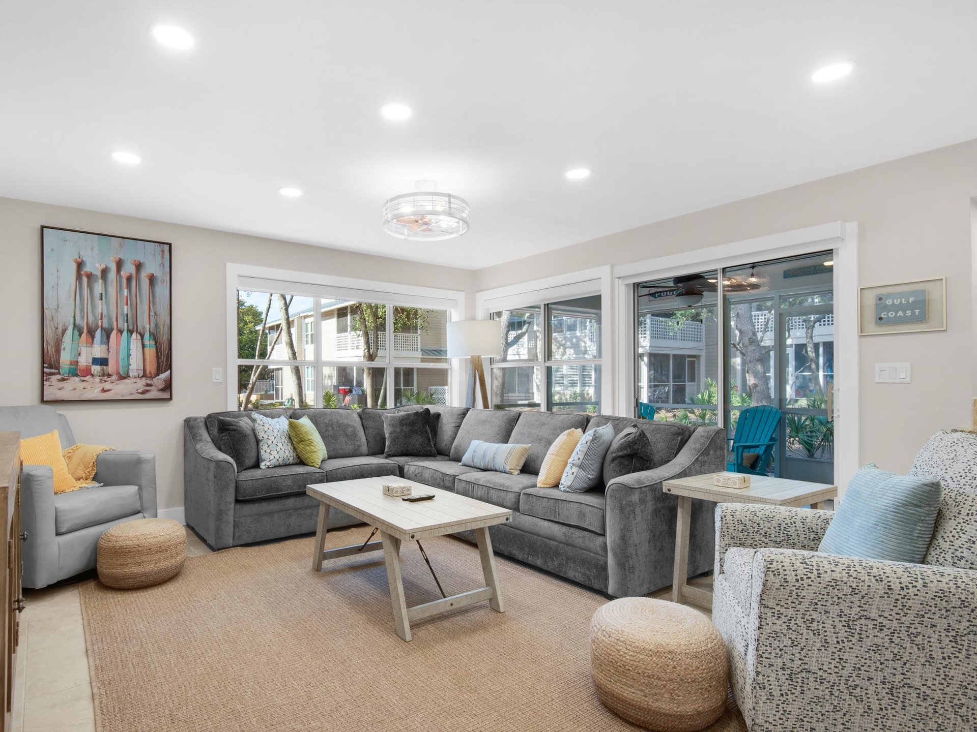 Plenty of seating and natural light streaming through sliding doors to your private patio