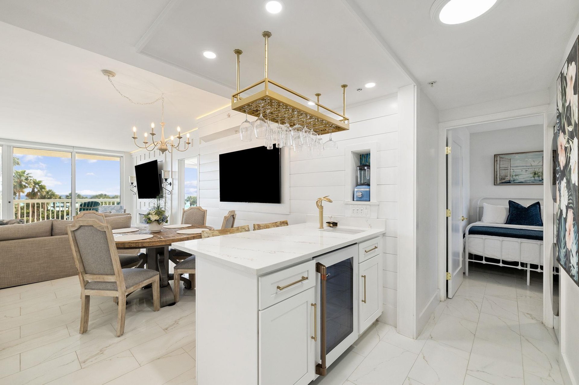 Your bright, elegant kitchen flows into the dining area with stunning ocean views through floortoceiling windows.