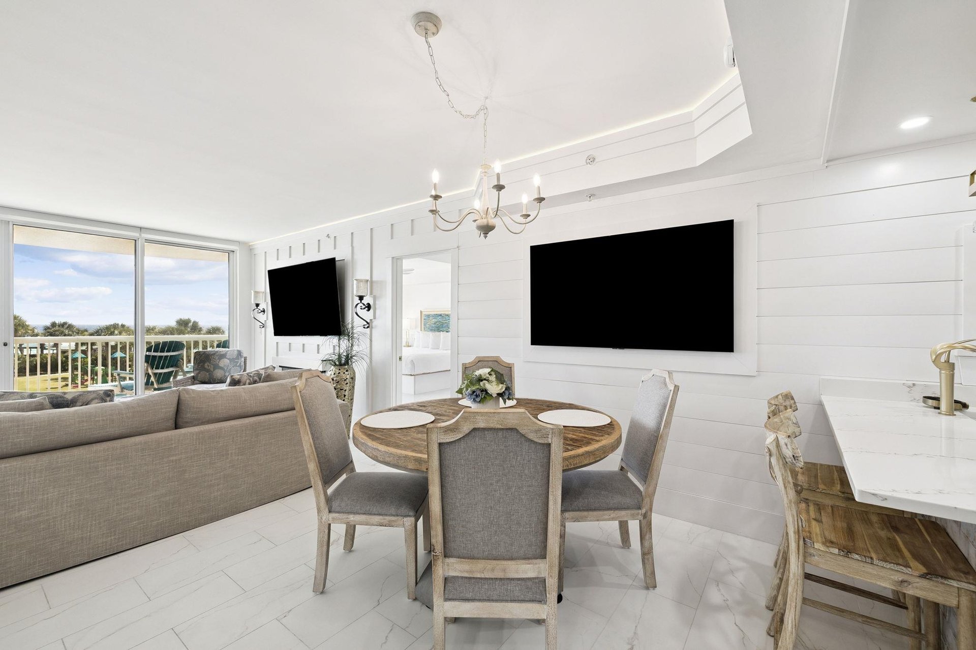 Relax in your bright openconcept space with elegant dining for six and dual wallmounted TVs for entertainment.