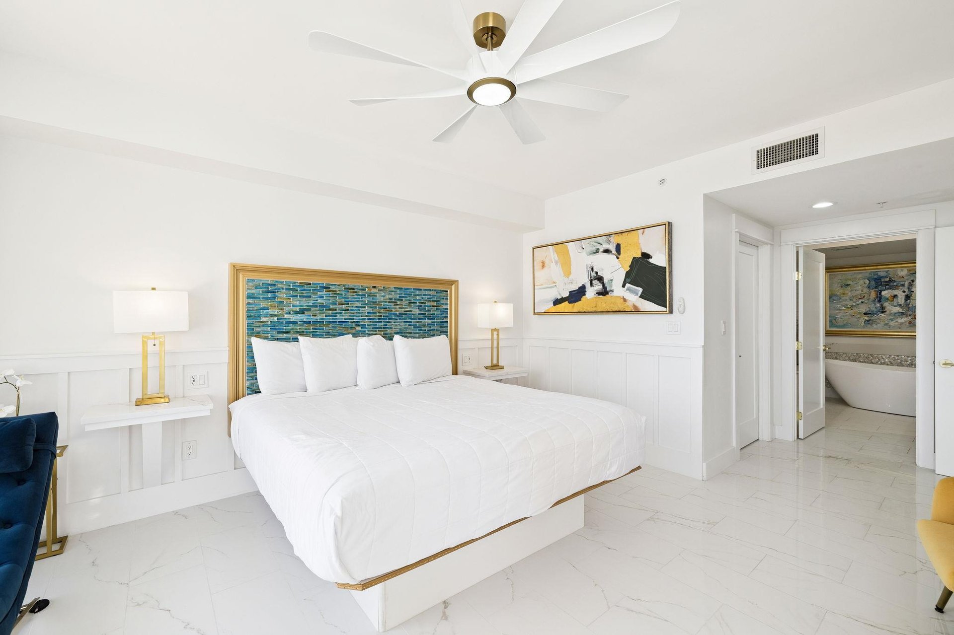 Unwind in your serene bedroom sanctuary with crisp linens, artistic touches, and modern comfort perfectly designed for restful nights.