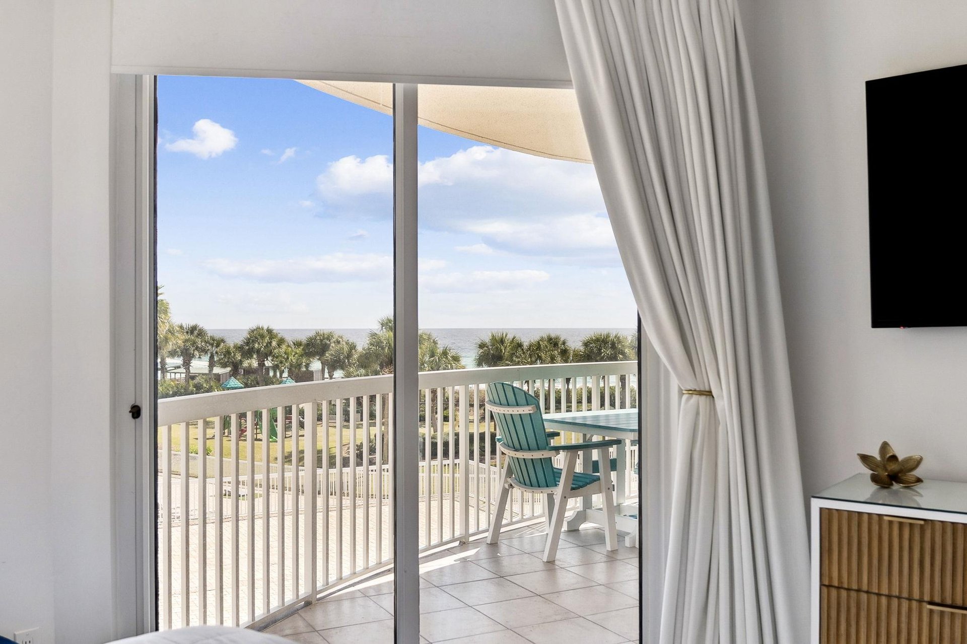 Step onto your private balcony and soak in stunning ocean views while relaxing in comfortable seating.