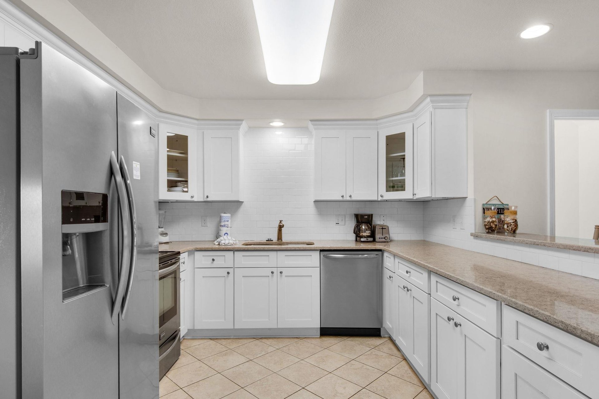 The spacious kitchen is perfect for preparing snacks  or chef inspired meals