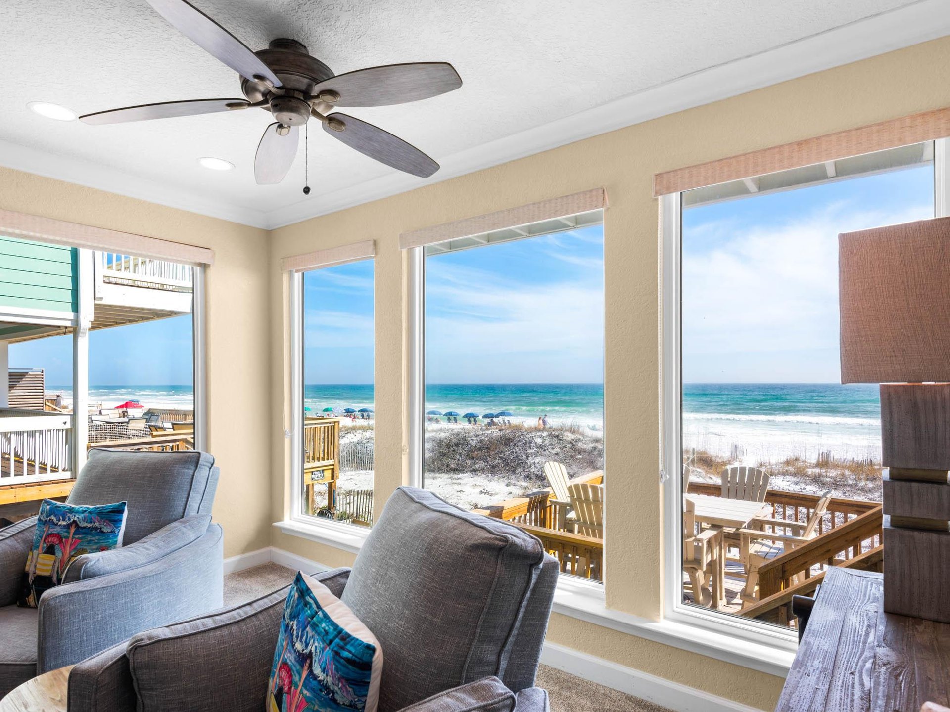 Relax in your comfortable living room while enjoying breathtaking beach views through expansive windows that bring the beach right to you.