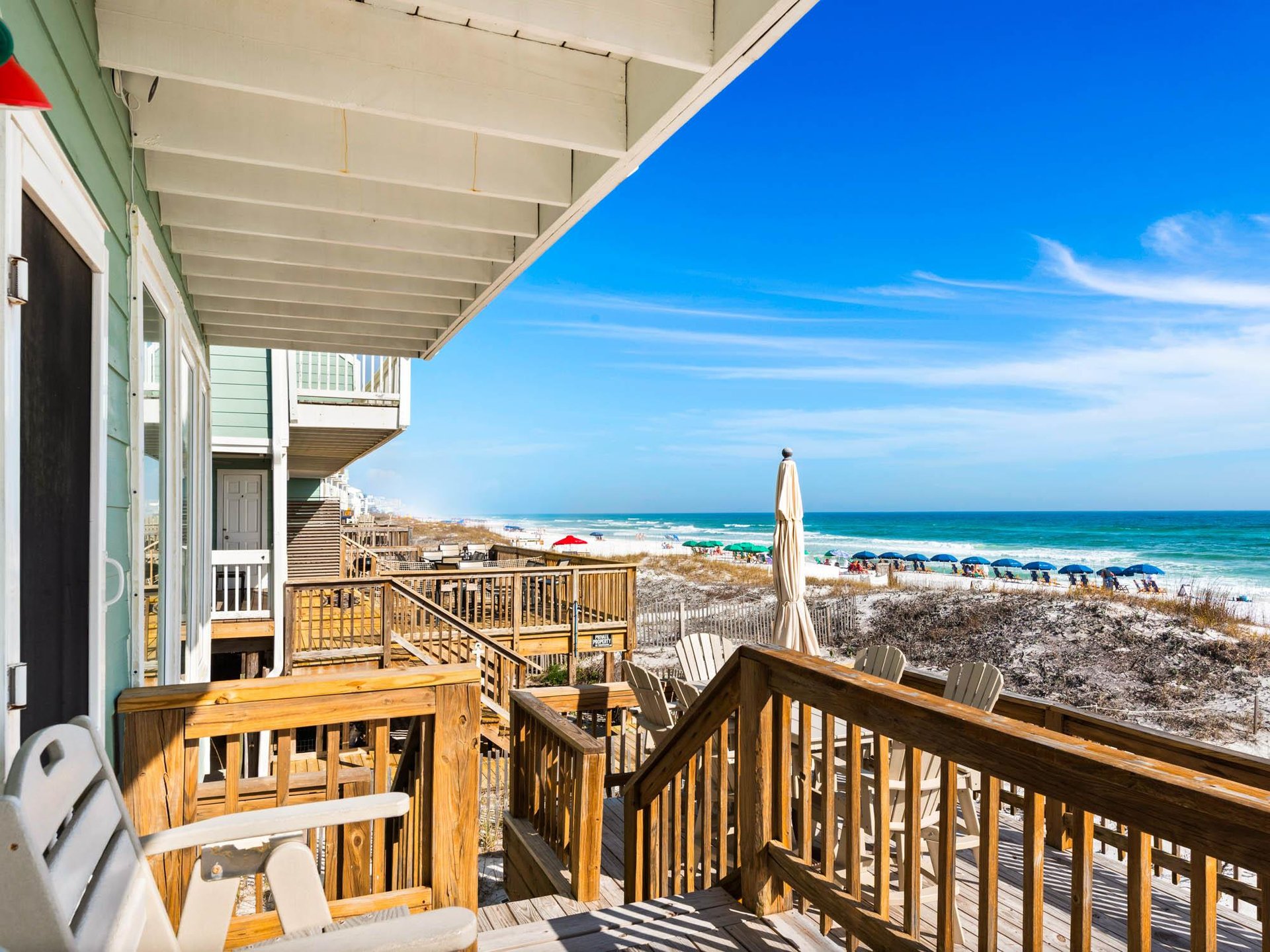 Beachfront deck with stunning Gulf views where youll enjoy morning coffee and evening sunsets just steps from the sand.