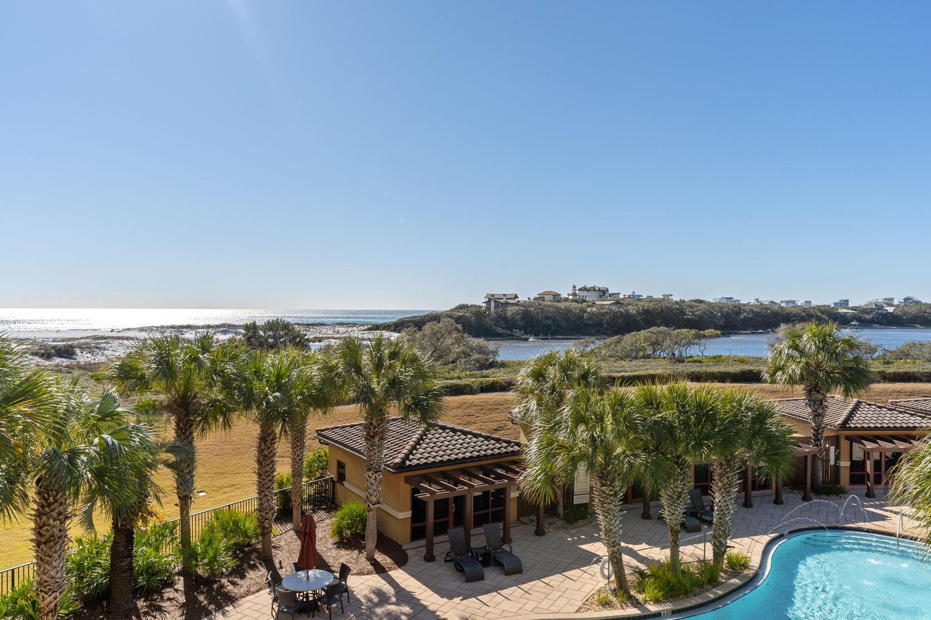 Soak in breathtaking coastline views surrounded by palm trees, a private pool, and expansive panoramic views of unspoiled beaches and winding waterways.