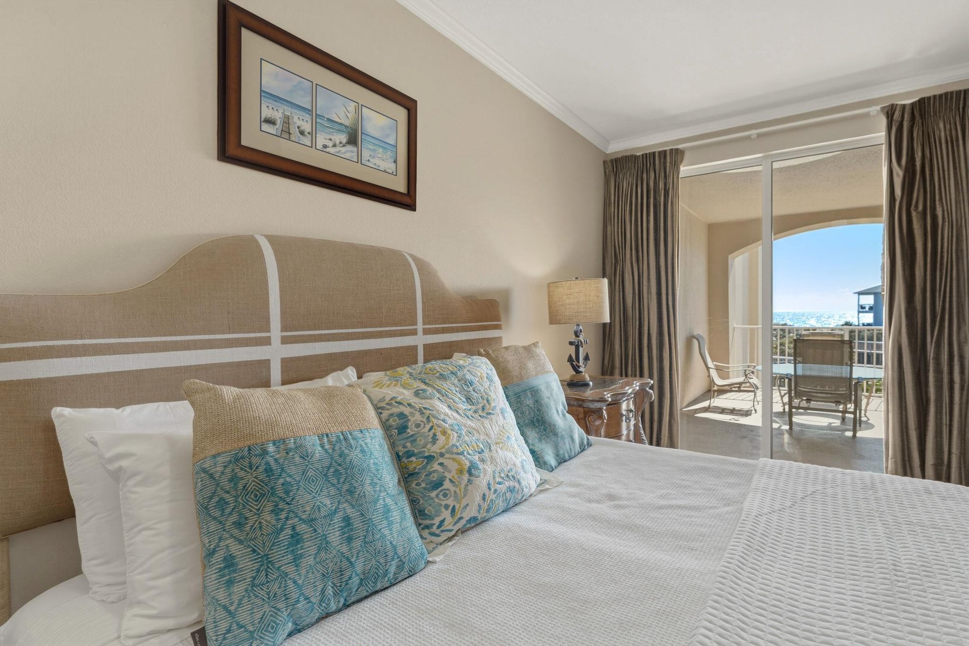 The elegant Primary bedroom features coastal colors and a private balcony where youll wake to beautiful views each morning.