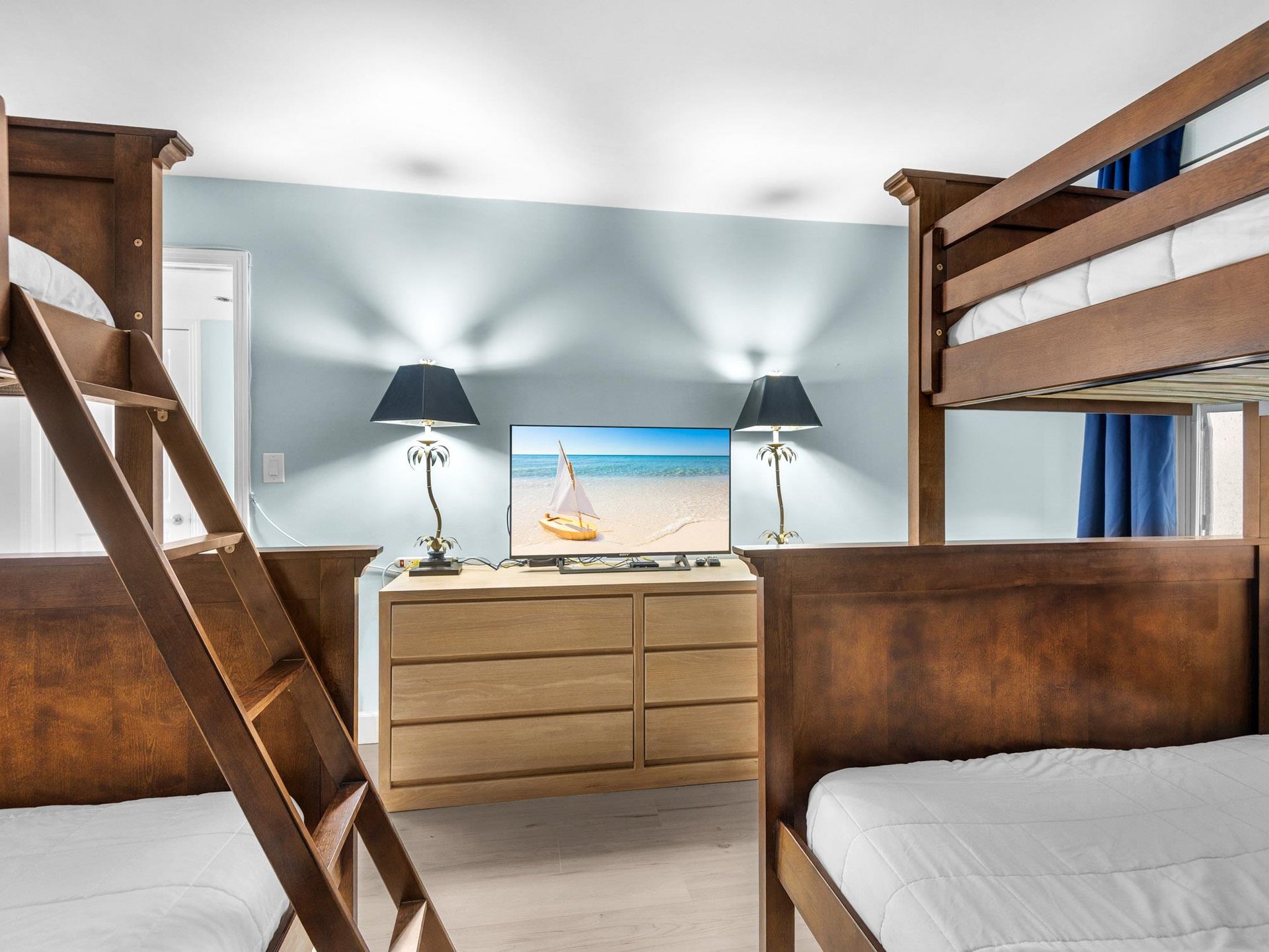 Bedroom 2  Your coastalthemed bedroom features sturdy bunk beds with crisp linens, tropical decor, and entertainment perfect for family adventures.