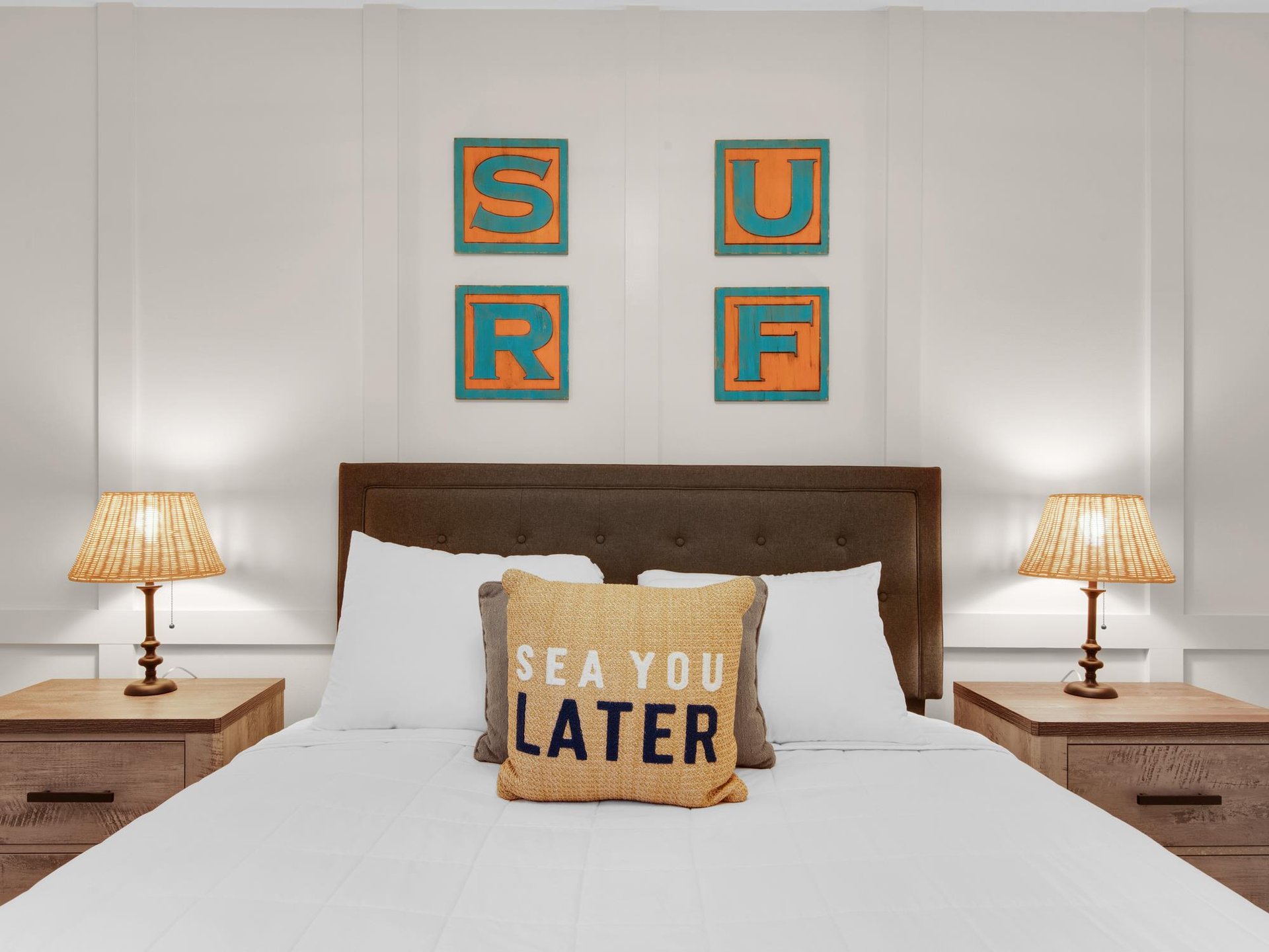 Bedroom 2  Beautiful accent wall with beachthemed artwork and playful pillows