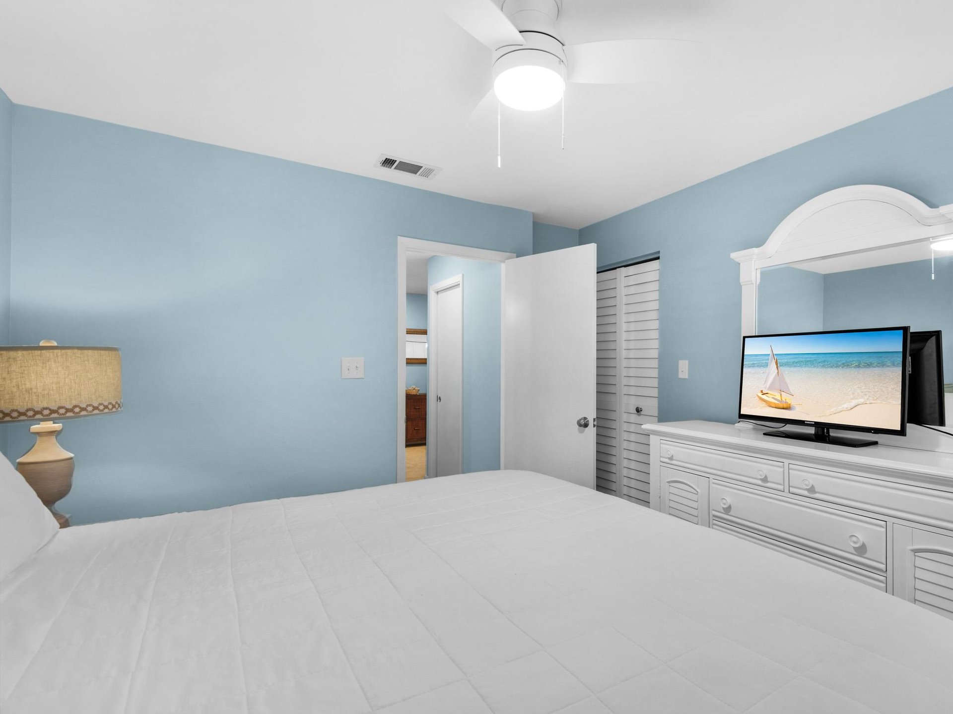 Bedroom 2 Unwind in your coastal bedroom with soothing blue walls and builtin entertainment center perfect for lazy evenings.