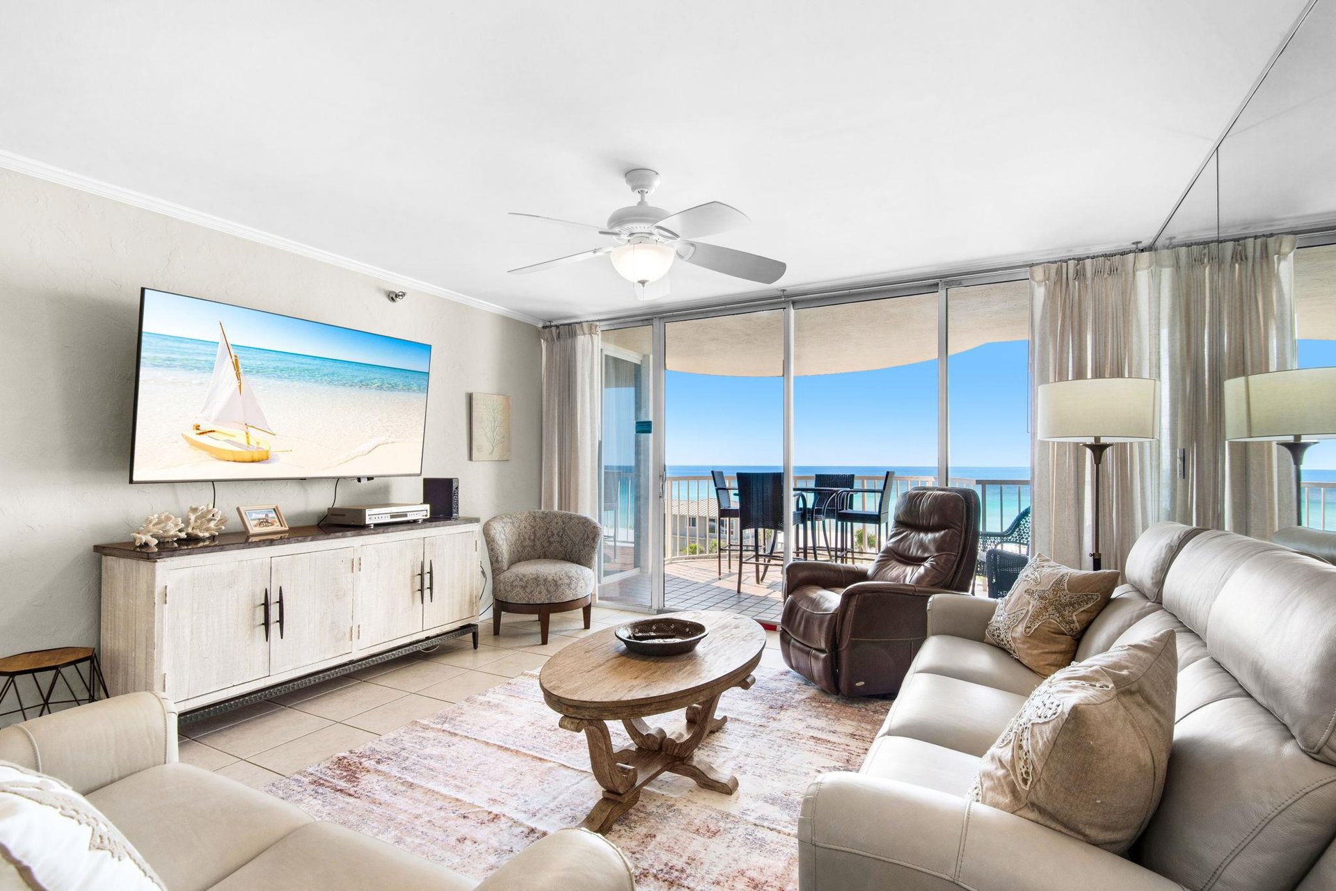 Relax in your oceanfront living room where floortoceiling windows frame endless sea views and your private balcony awaits.