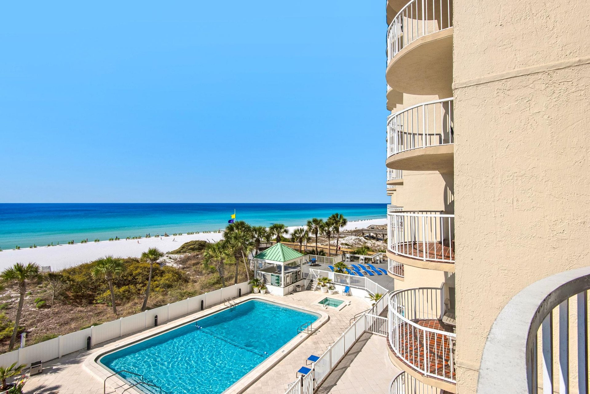 Step onto your private balcony and take in stunning turquoise waters and pristine white sand stretching endlessly before you.