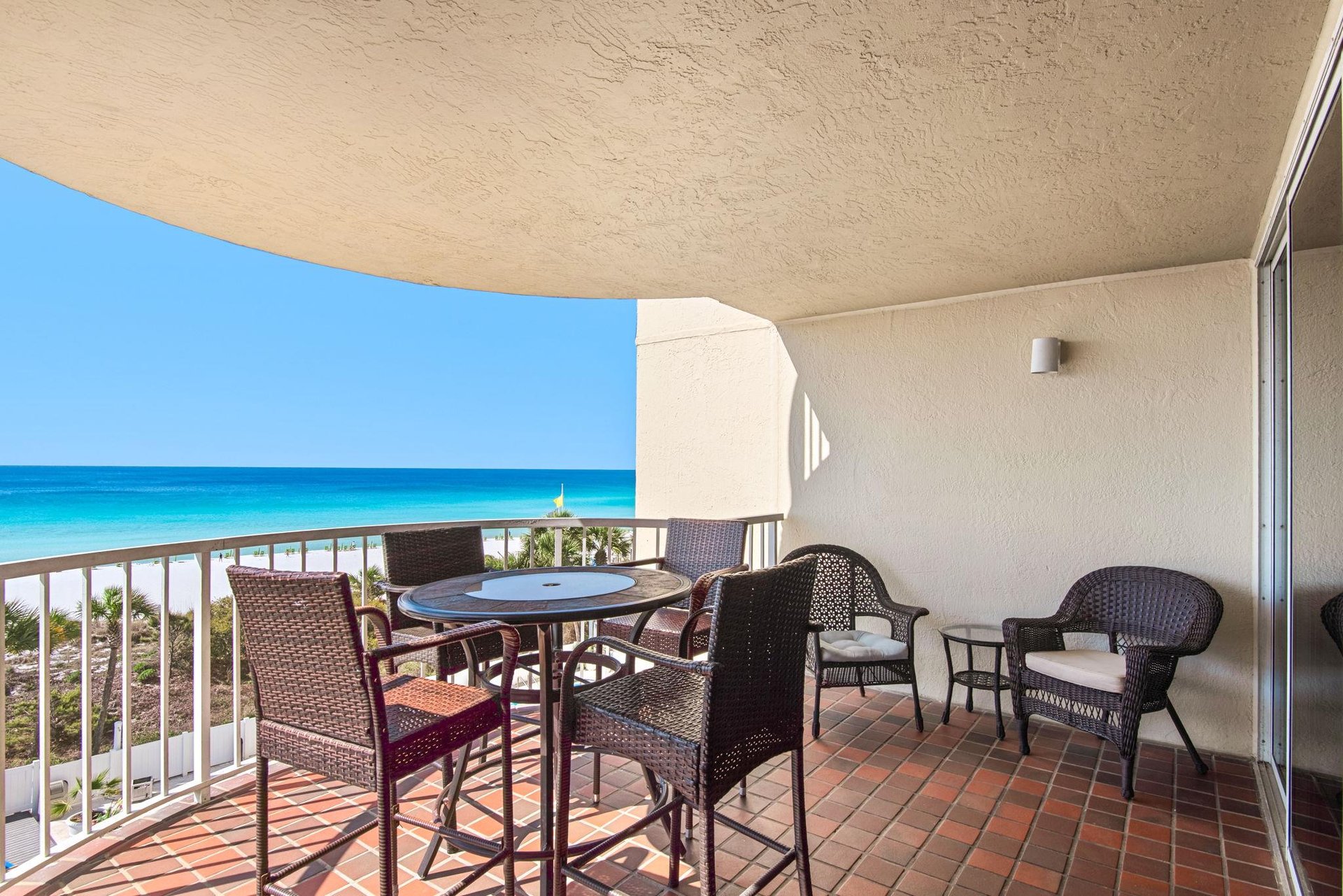 Your private balcony offers stunning ocean views where you can dine al fresco while watching the turquoise waves.