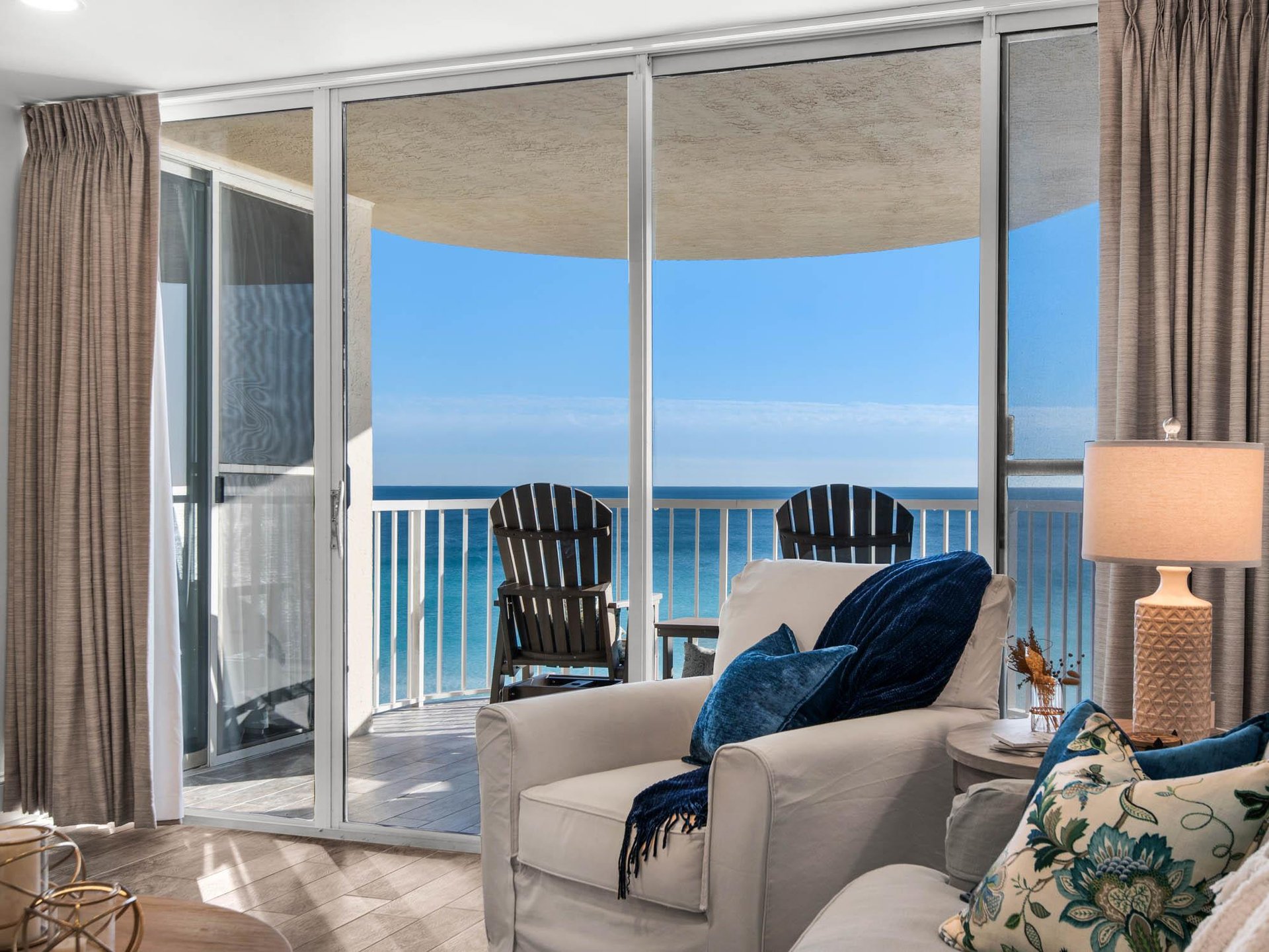 Unwind in this bright oceanfront living space where floortoceiling windows frame endless sea views from your private balcony.