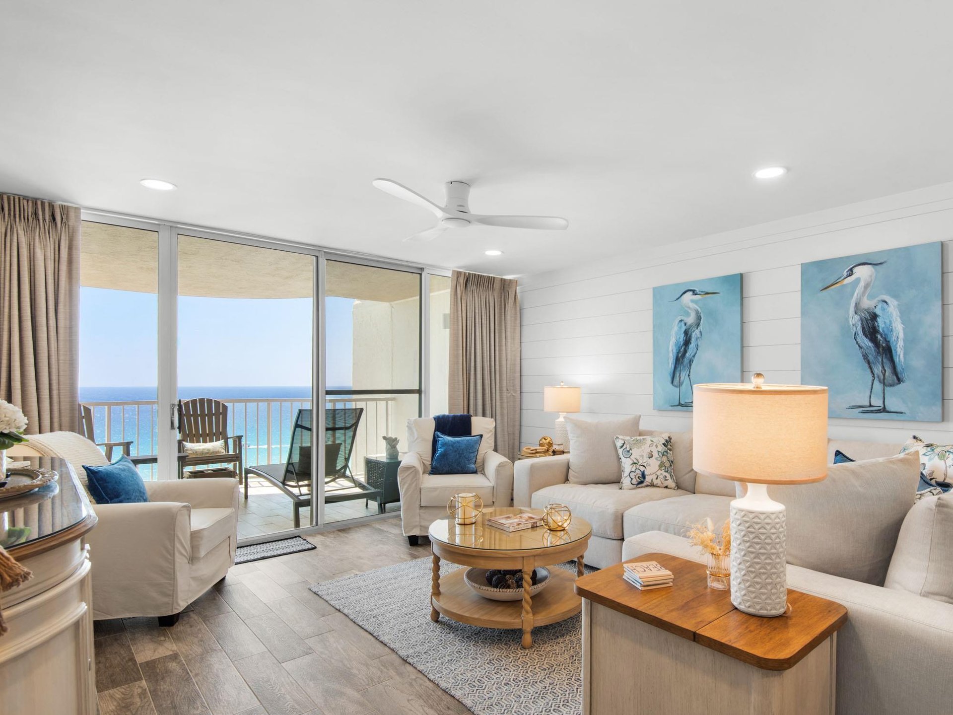 Relax in your bright coastal living room with stunning ocean views through floortoceiling windows and comfortable seating.