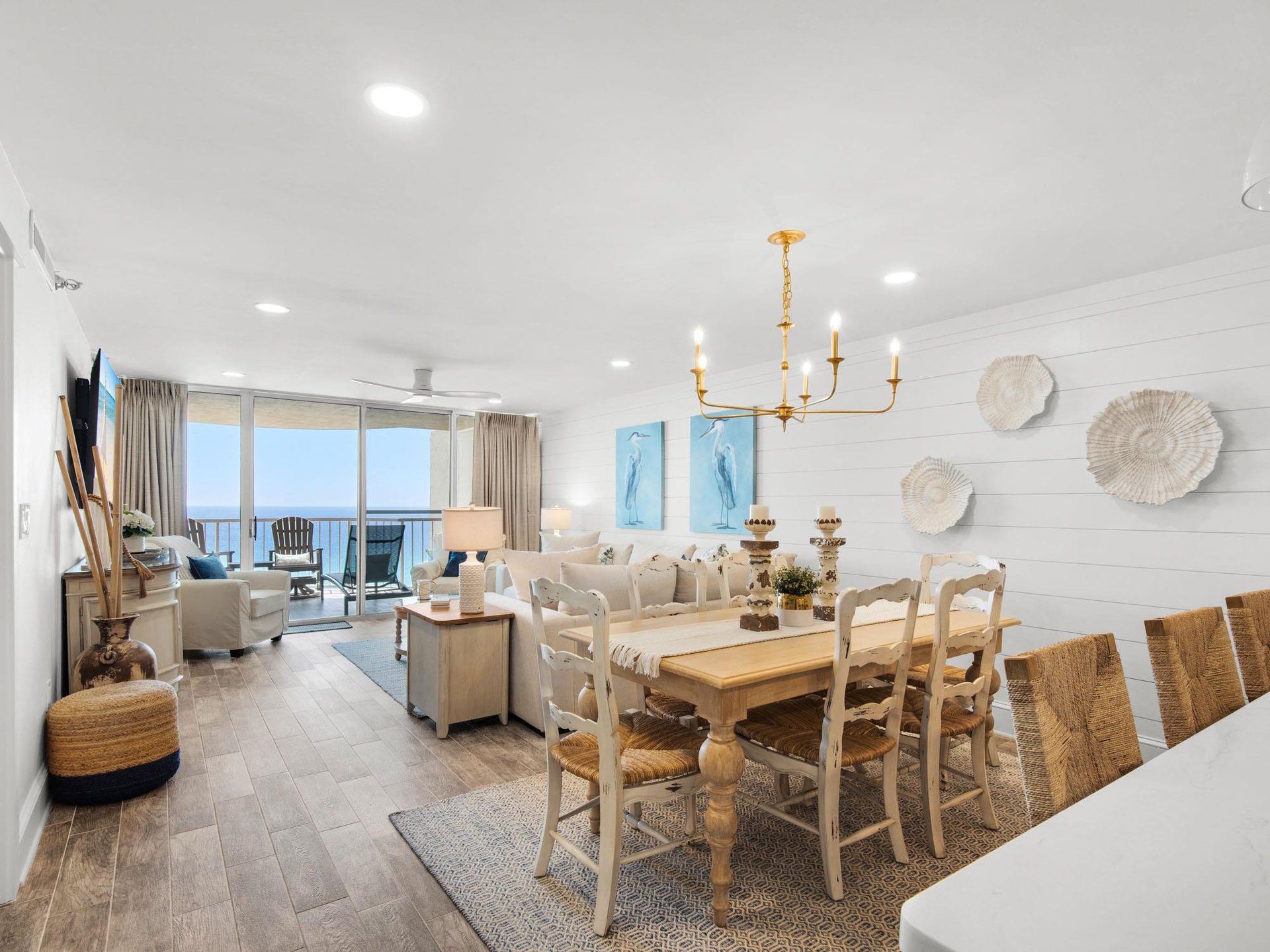Relax in your bright, coastalthemed living space where ocean views frame cozy seating and a welcoming dining table for memorable meals.