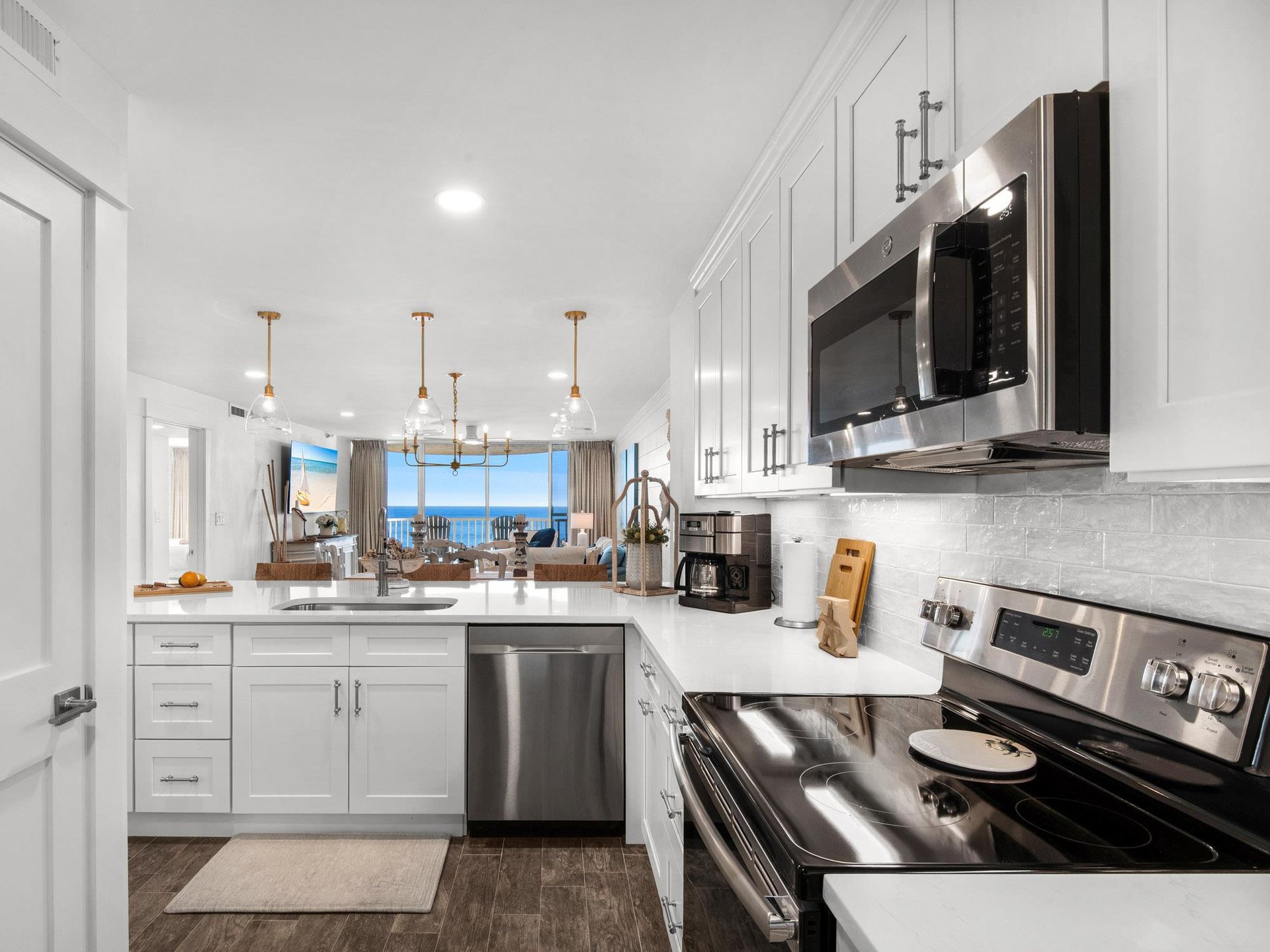 Your dream kitchen awaits with sparkling countertops, stainless steel appliances, and ocean views that make every meal magical.