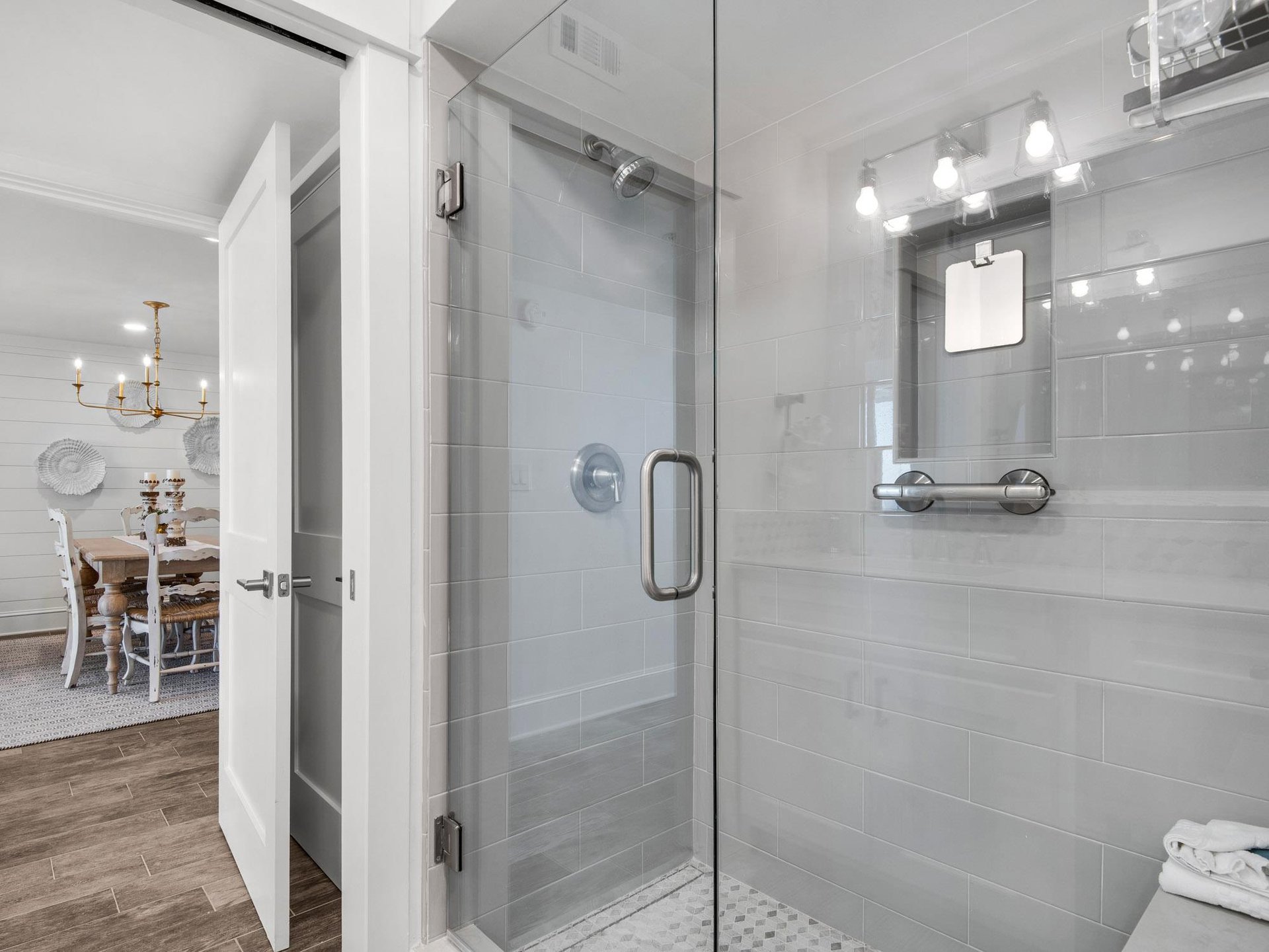 Bathroom 1 Step into your private glassenclosed shower with elegant gray tiles and modern fixtures, perfectly lit for your daily refresh.