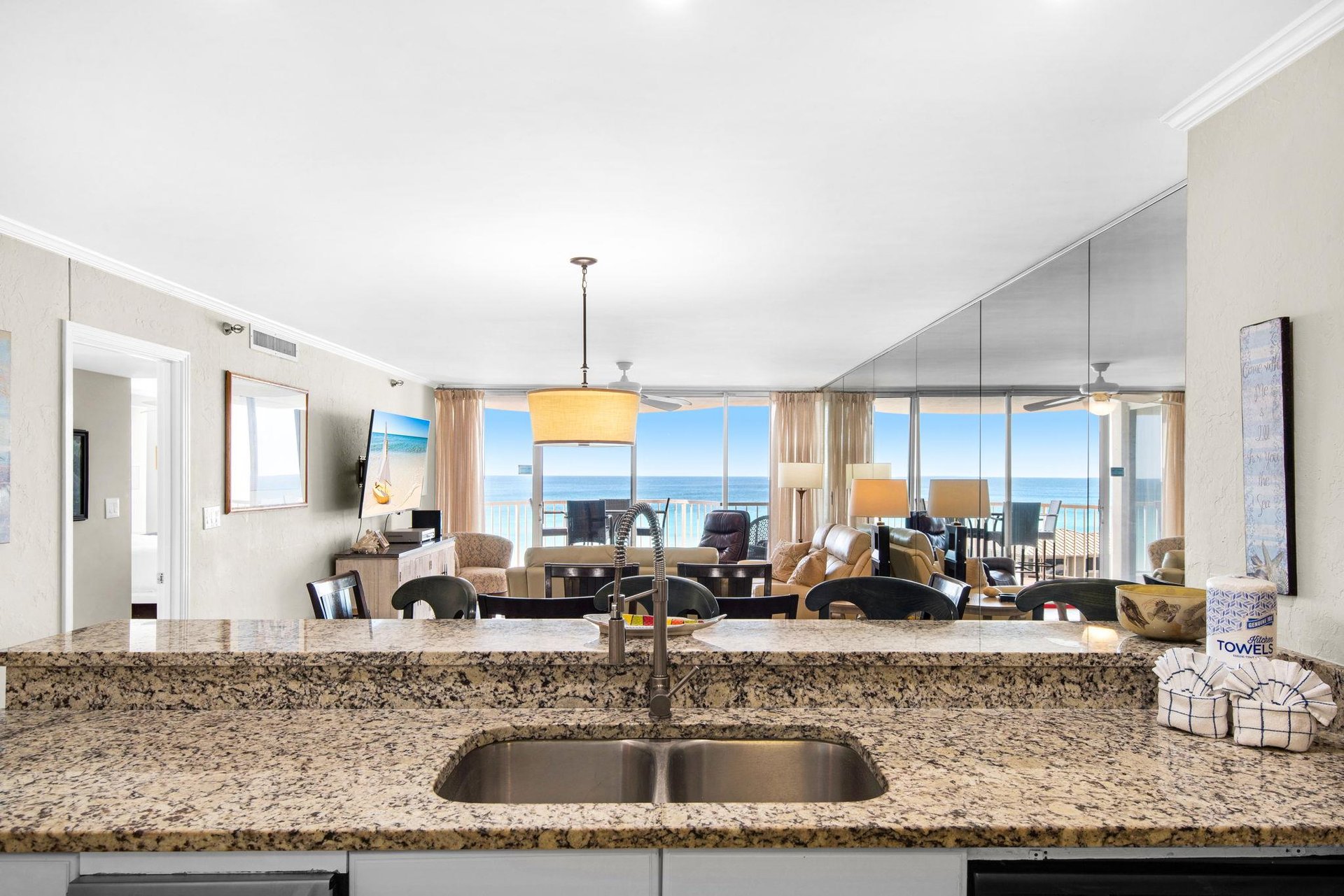 Cook with stunning ocean views from your granite kitchen while enjoying the openconcept design that flows into your beachfront living space.