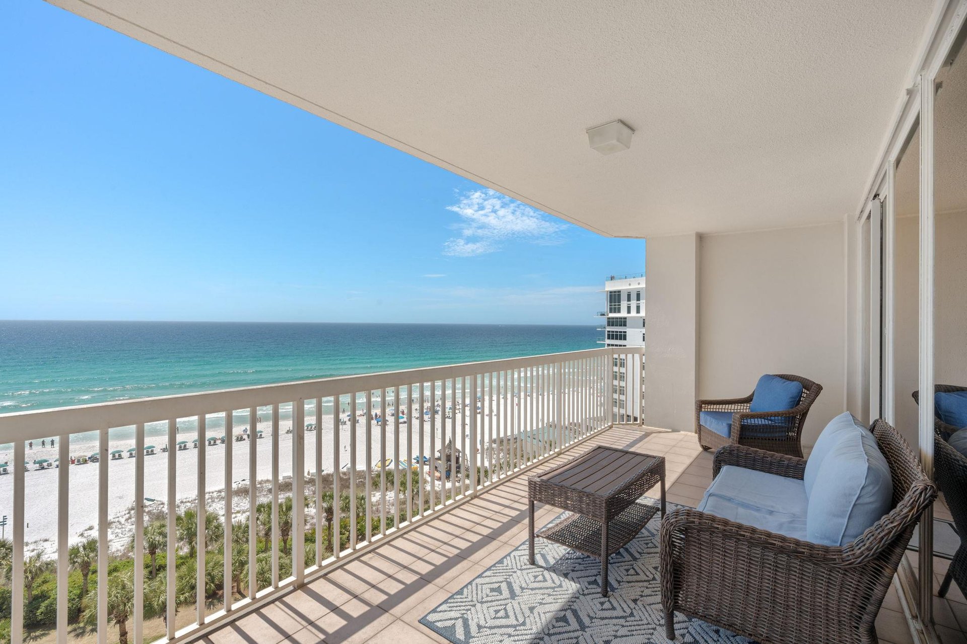 Unwind on your private oceanfront balcony with panoramic beach views. Comfortable seating awaits for morning coffee or evening sunsets over pristine Gulf waters.