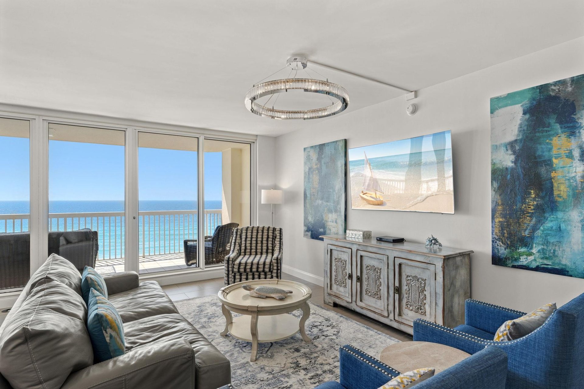 Your elegant living room frames stunning ocean views through floortoceiling windows, creating the perfect retreat.