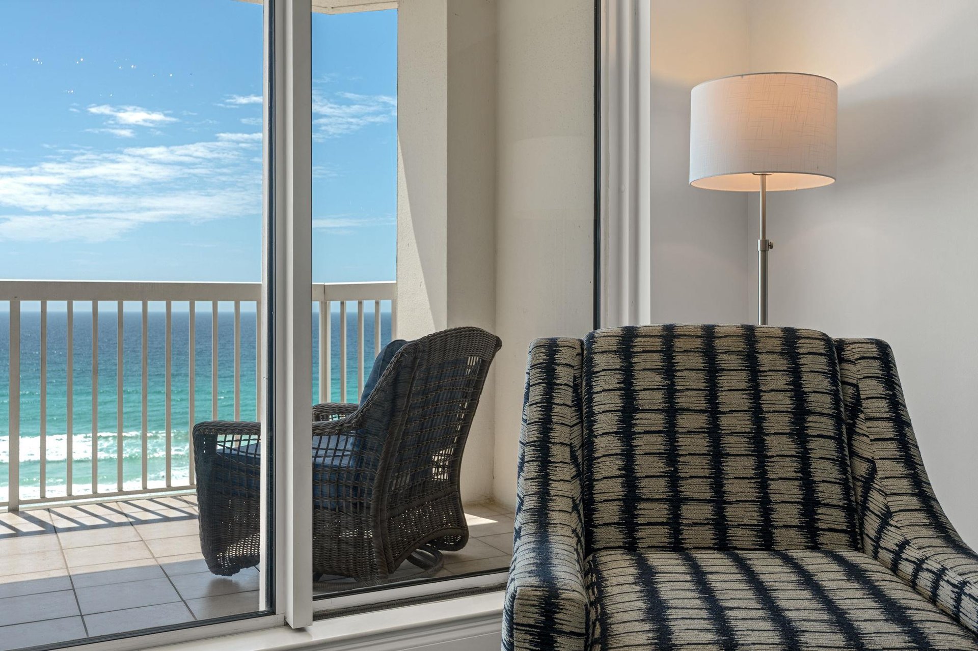 Sink into this comfortable chair and soak up stunning ocean views through your private balcony doors.