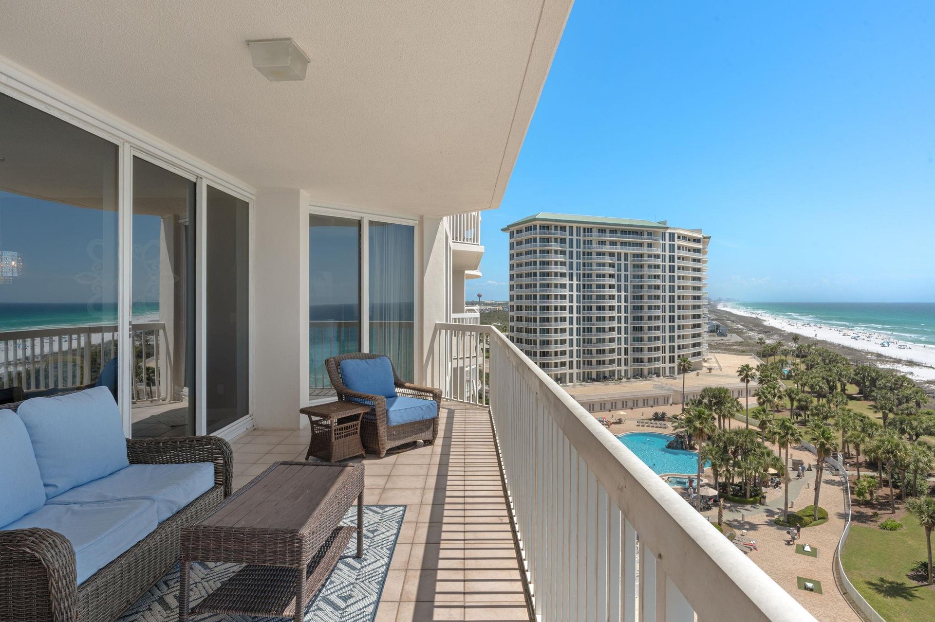Relax on your private balcony with ocean views, watching waves while lounging on comfortable outdoor furniture with stunning coastal scenery.