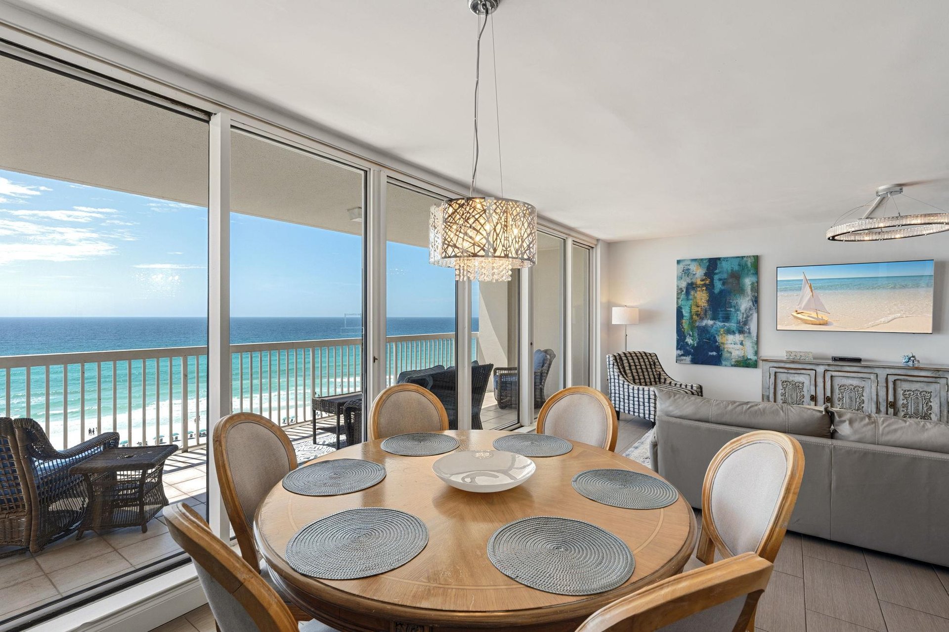 Wake up to stunning ocean views through floortoceiling windows in your bright, elegant dining space with direct beach access.