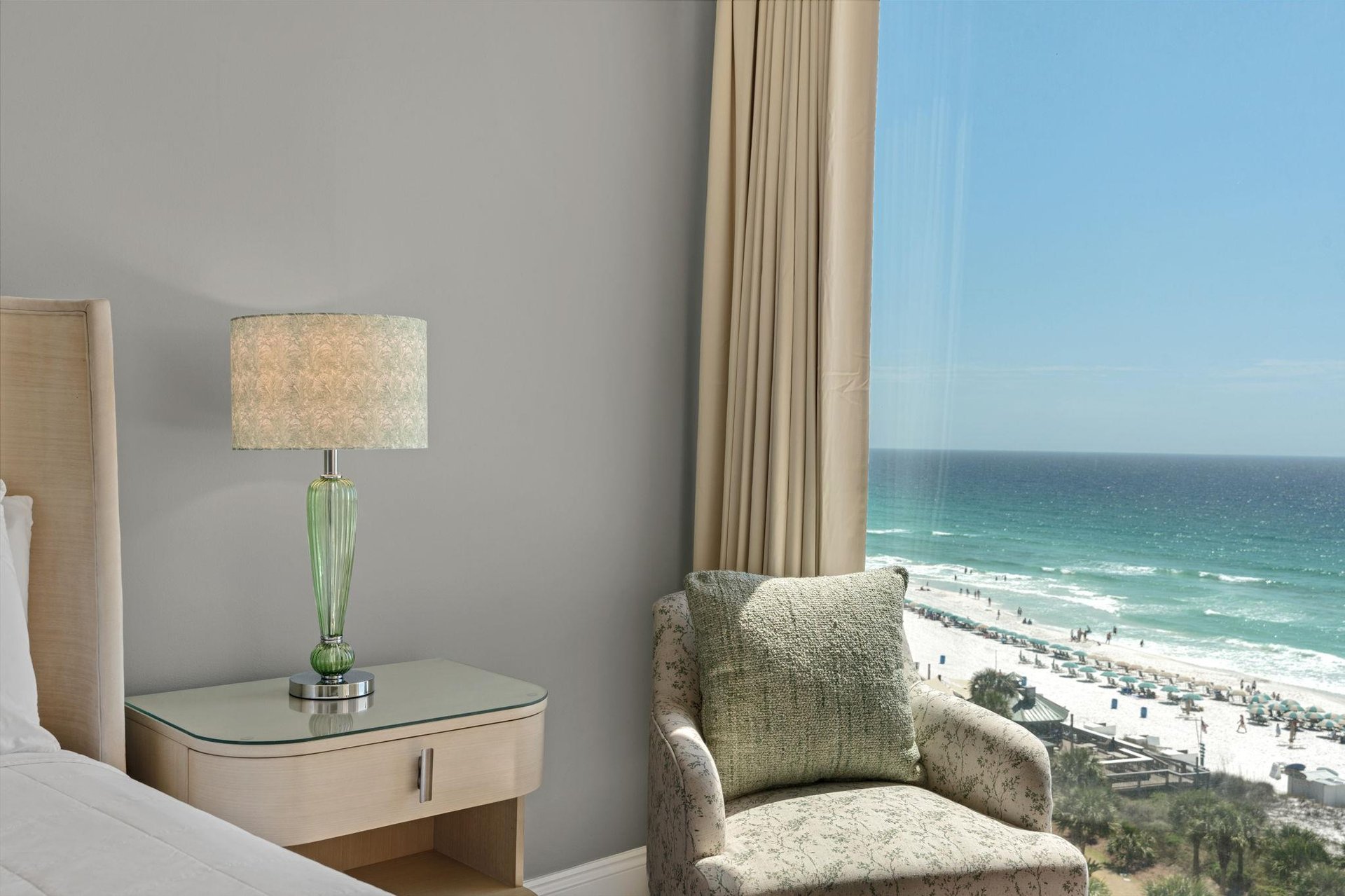 Relax in your comfortable chair while gazing at the stunning ocean view through floortoceiling windows.