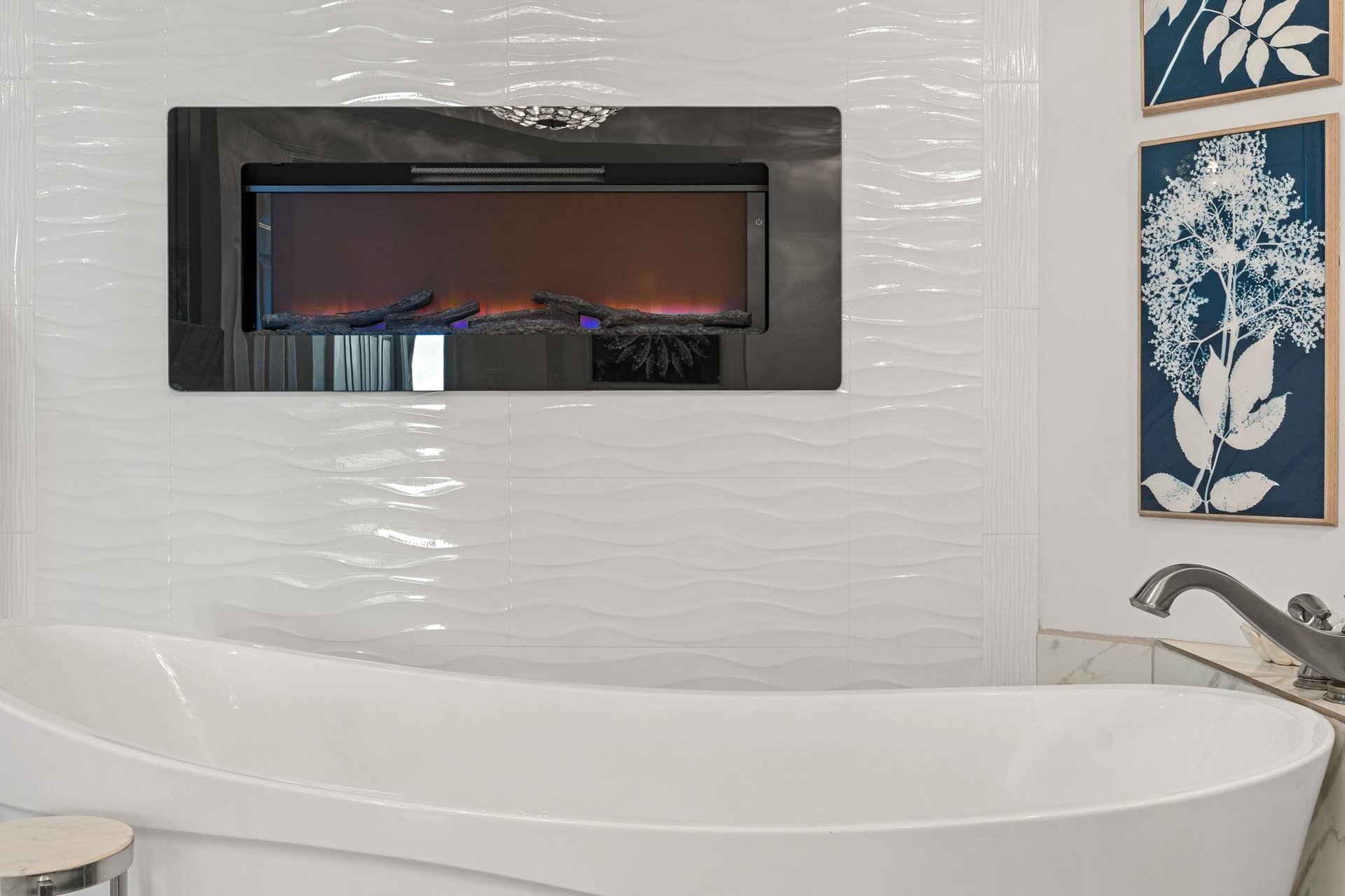 Indulge in pure luxury as you soak in your elegant freestanding tub, warmed by the gentle glow of the fireplace.