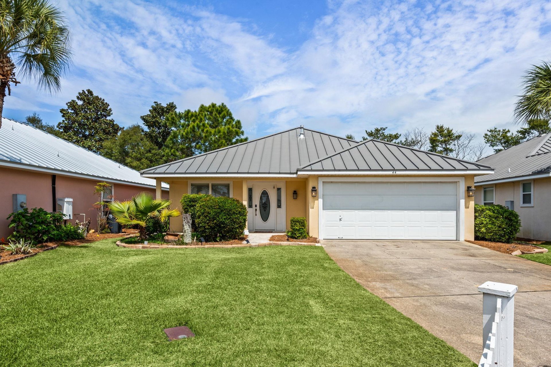 Charming singlestory home with convenient parking in a peaceful gated neighborhood.