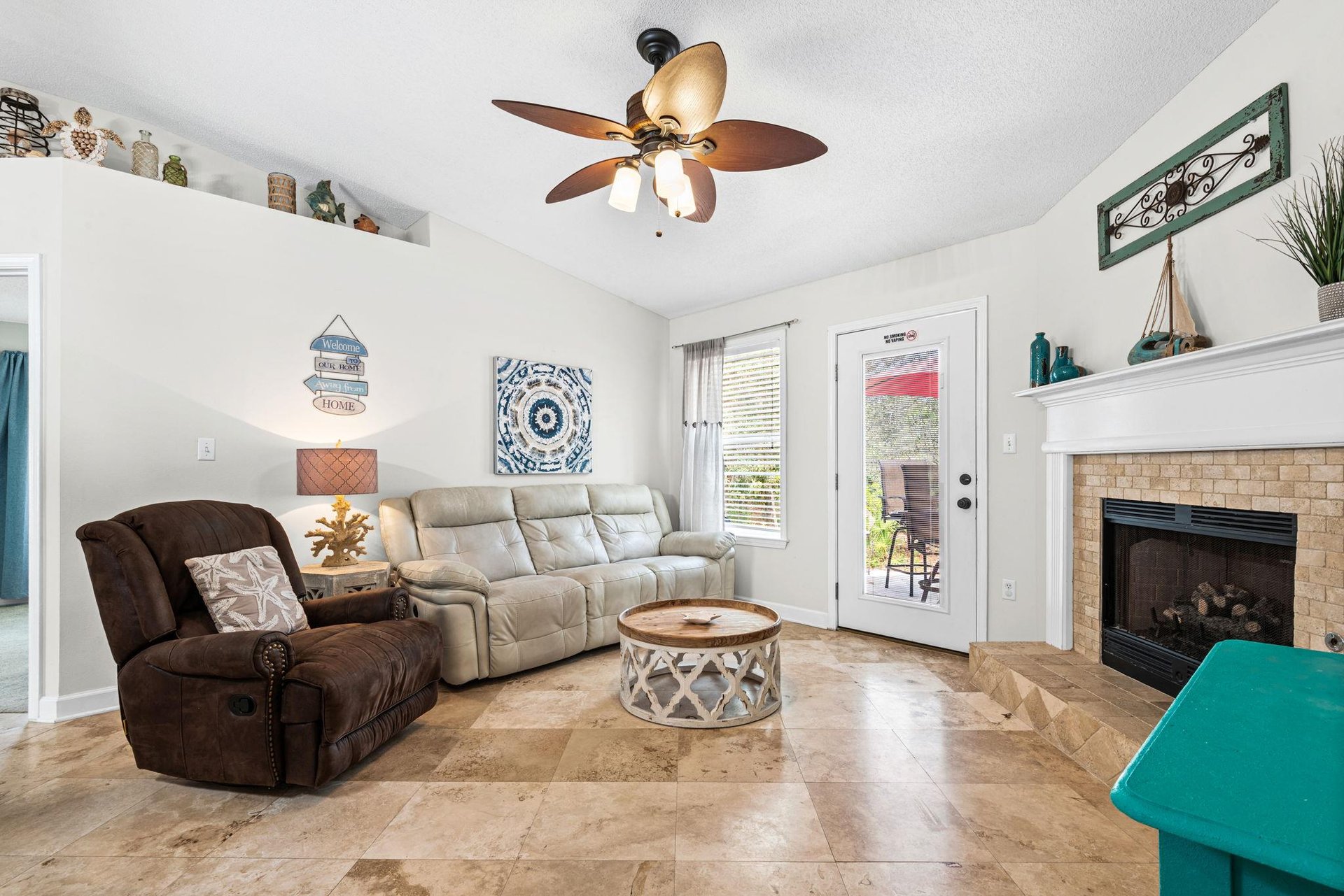 Unwind in the cozy living room with plush seating and coastal décor, perfect relaxation after your adventures.