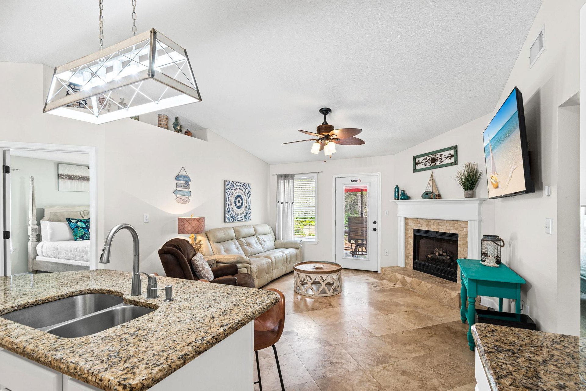 Your openconcept haven features granite counters, cozy fireplace, and stylish living area where memories unfold naturally.