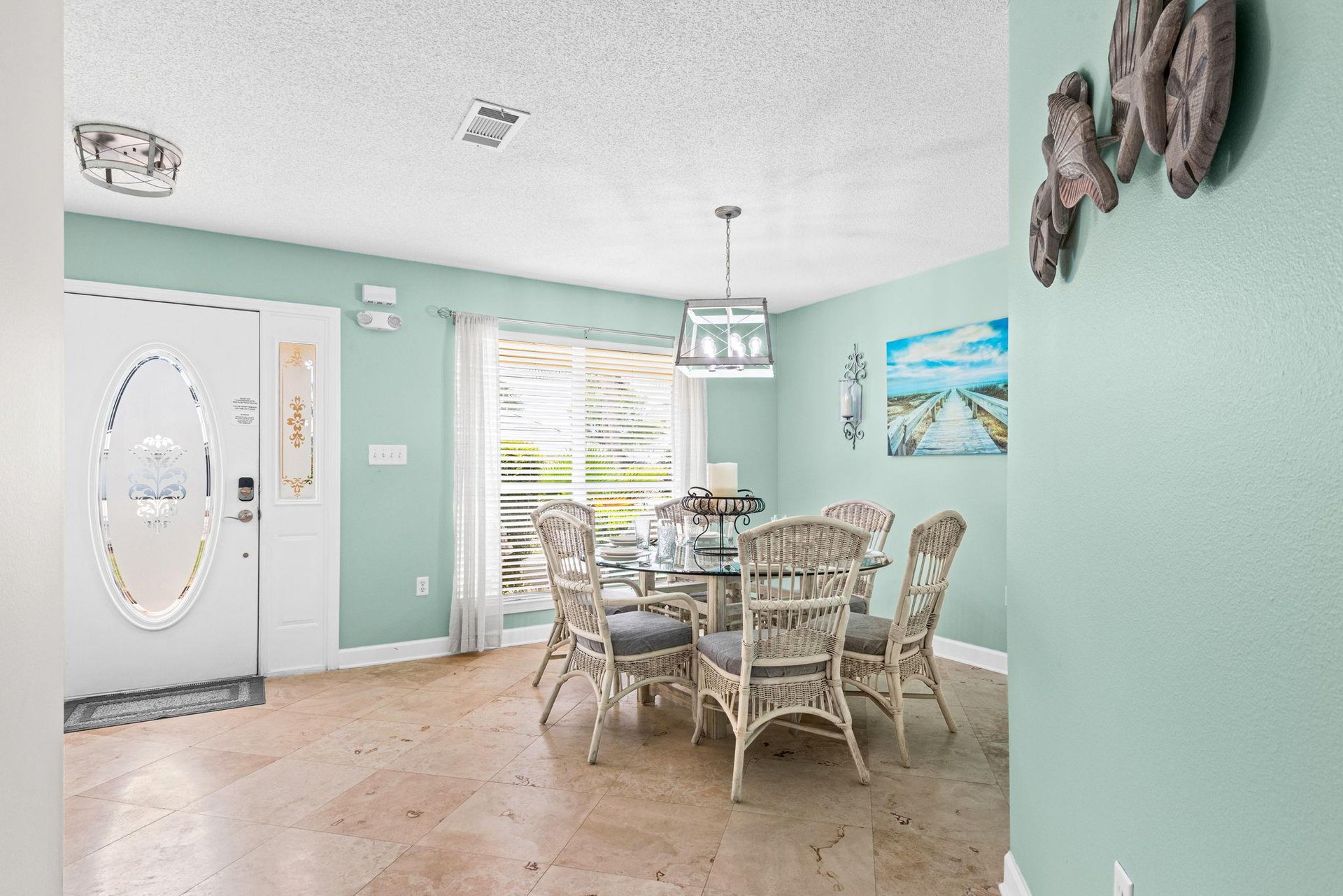 Dining area, perfect place for meals or family game time. Additional seating at breakfast bar in kitchen.