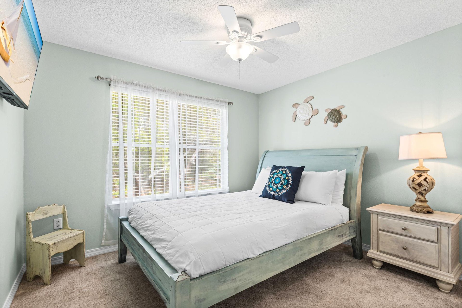 Bedroom 2  Drift off to peaceful sleep in your serene coastalthemed bedroom, complete with soft linens