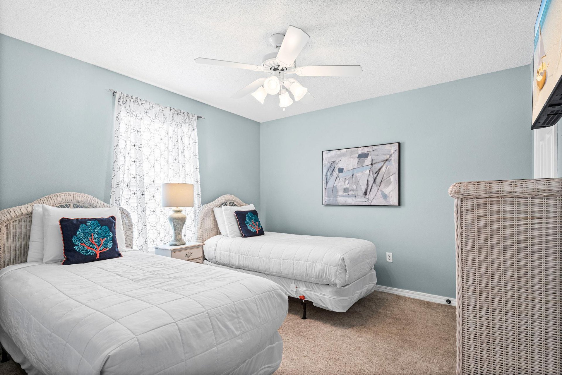 Bedroom 3  Drift off peacefully in your serene twin bedroom with soft blue walls and coastal charm.